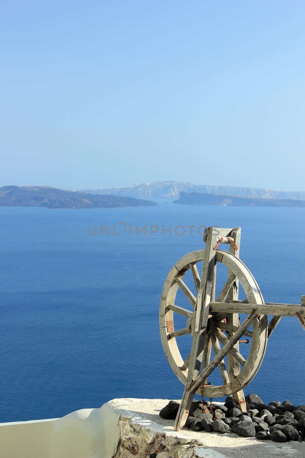 beautiful bay of Oia with clear blue sky and sea - Santorini, Greece