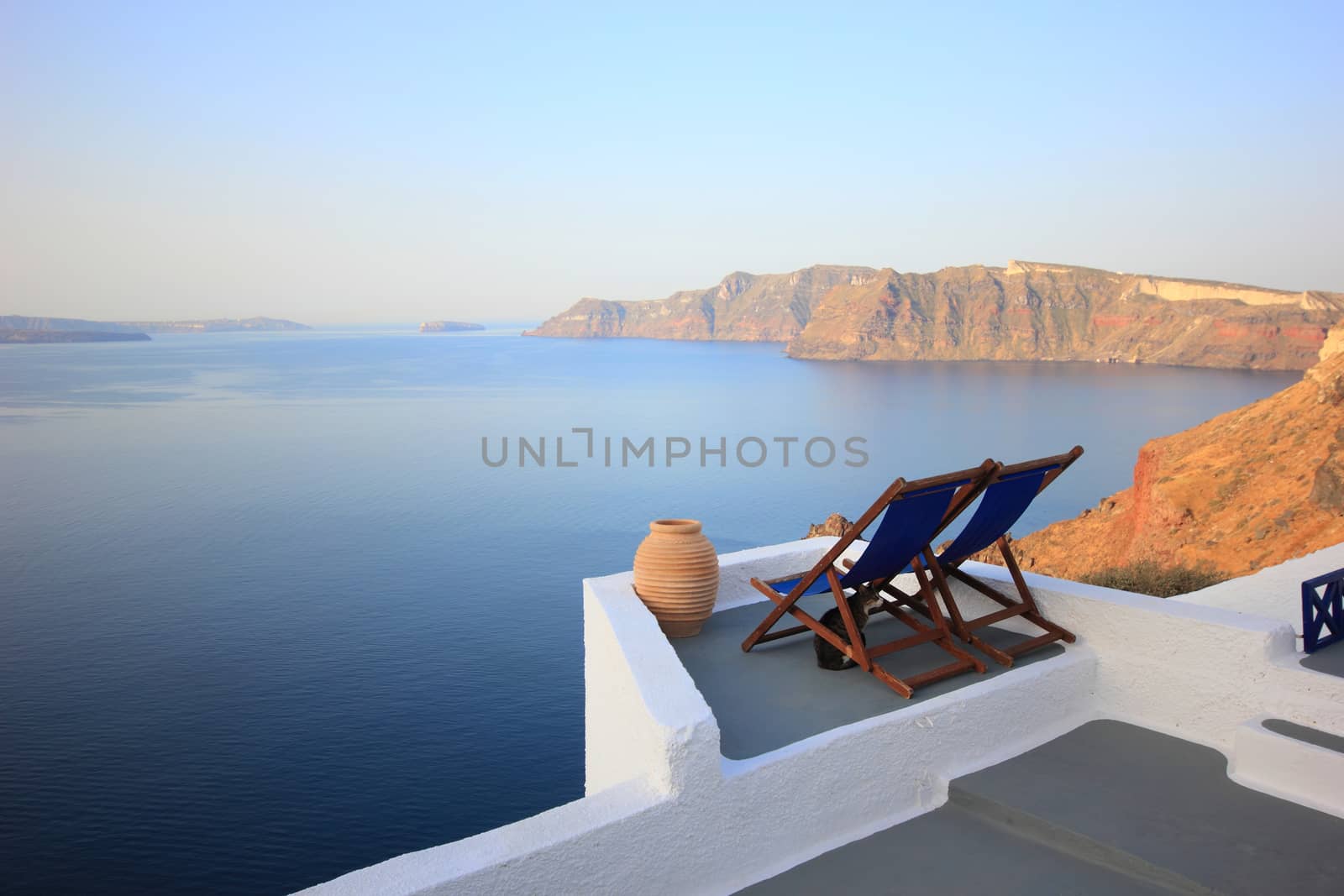 View on caldera and sea from balcony by Netfalls