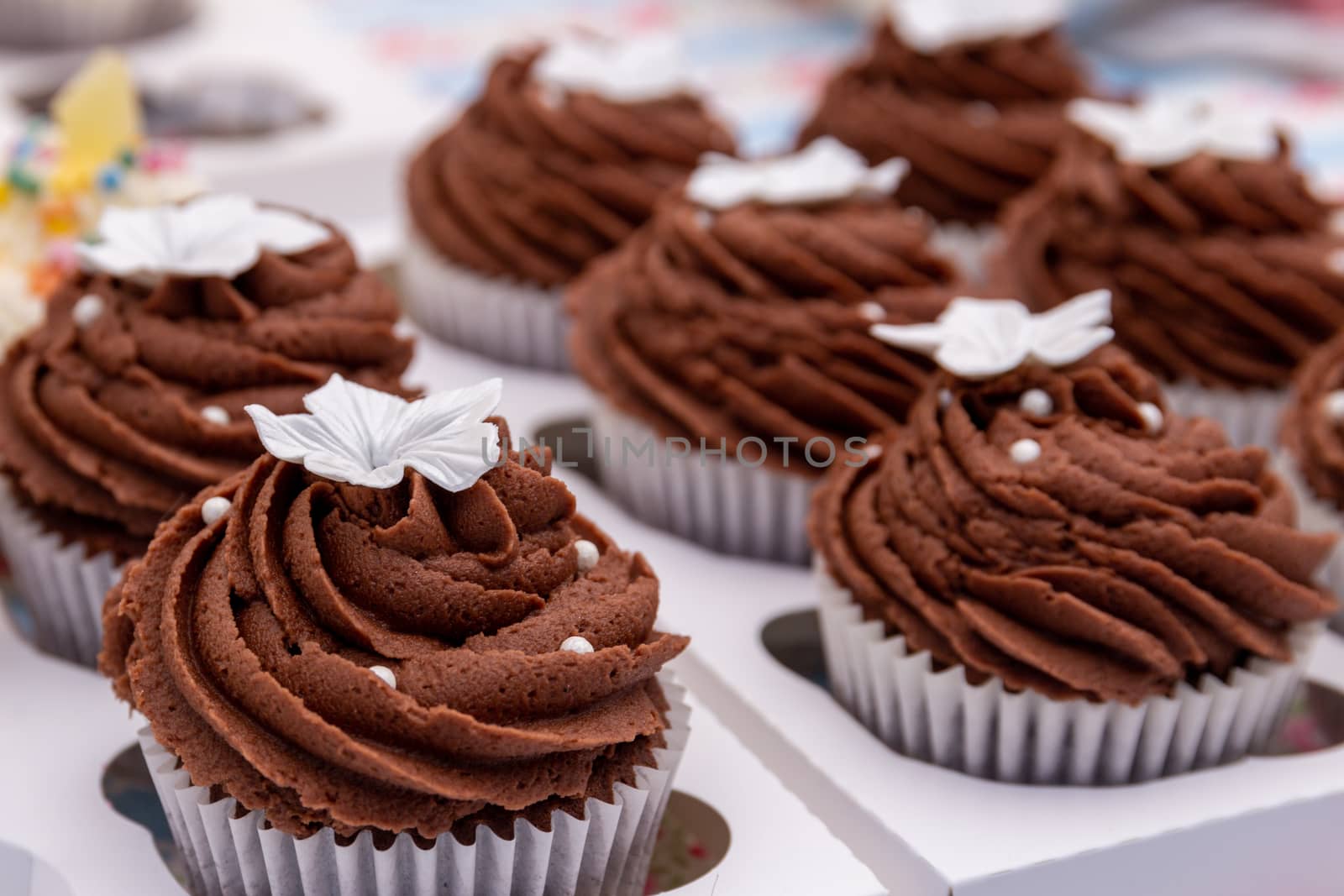 Homemade chocolate cupcakes on a market stall
