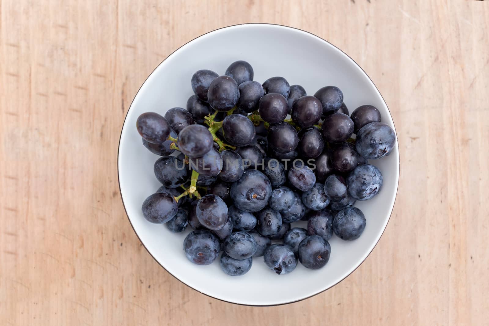 Bowl of ripe blueberries by magicbones