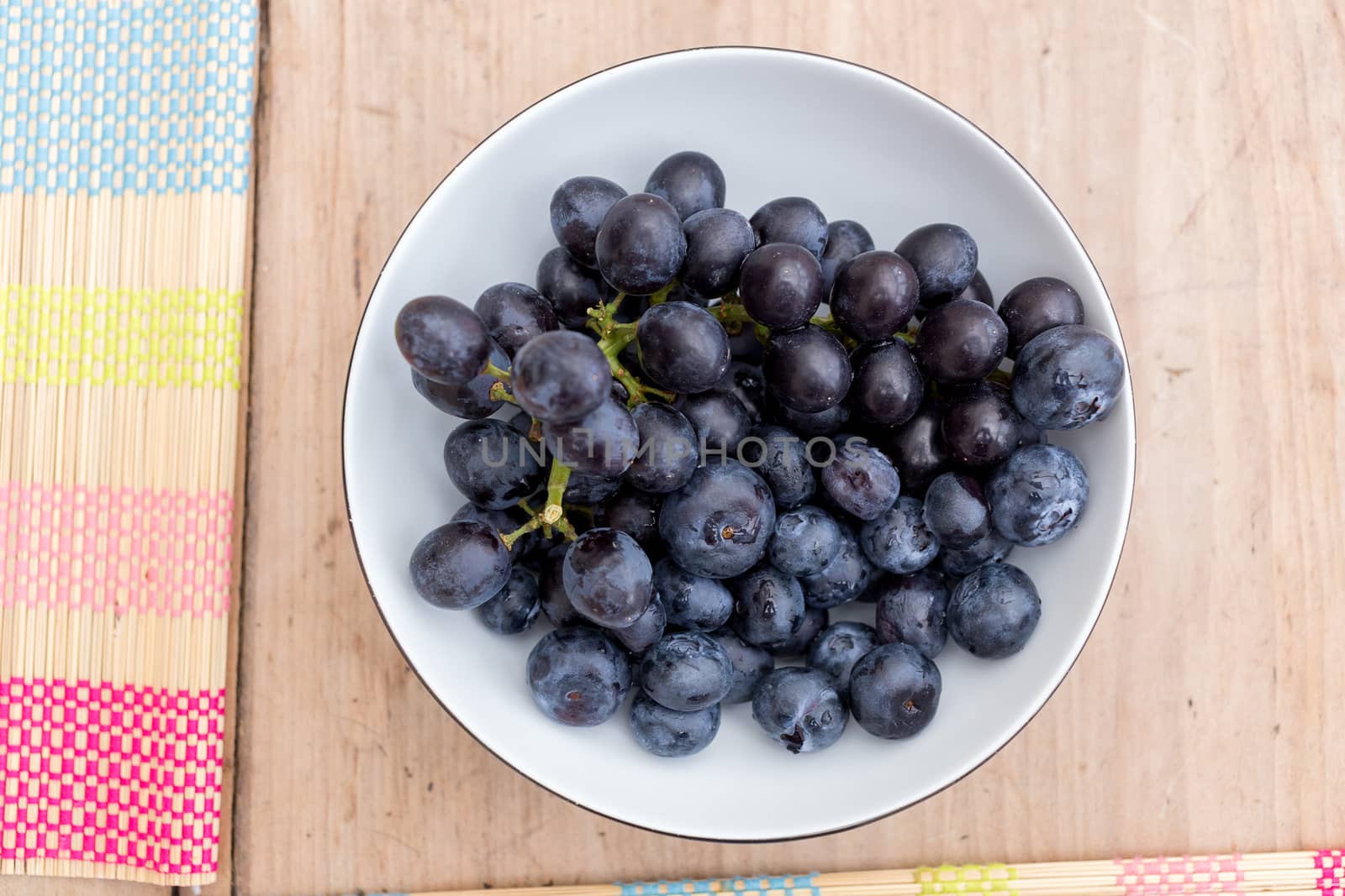 Bowl of ripe blueberries by magicbones