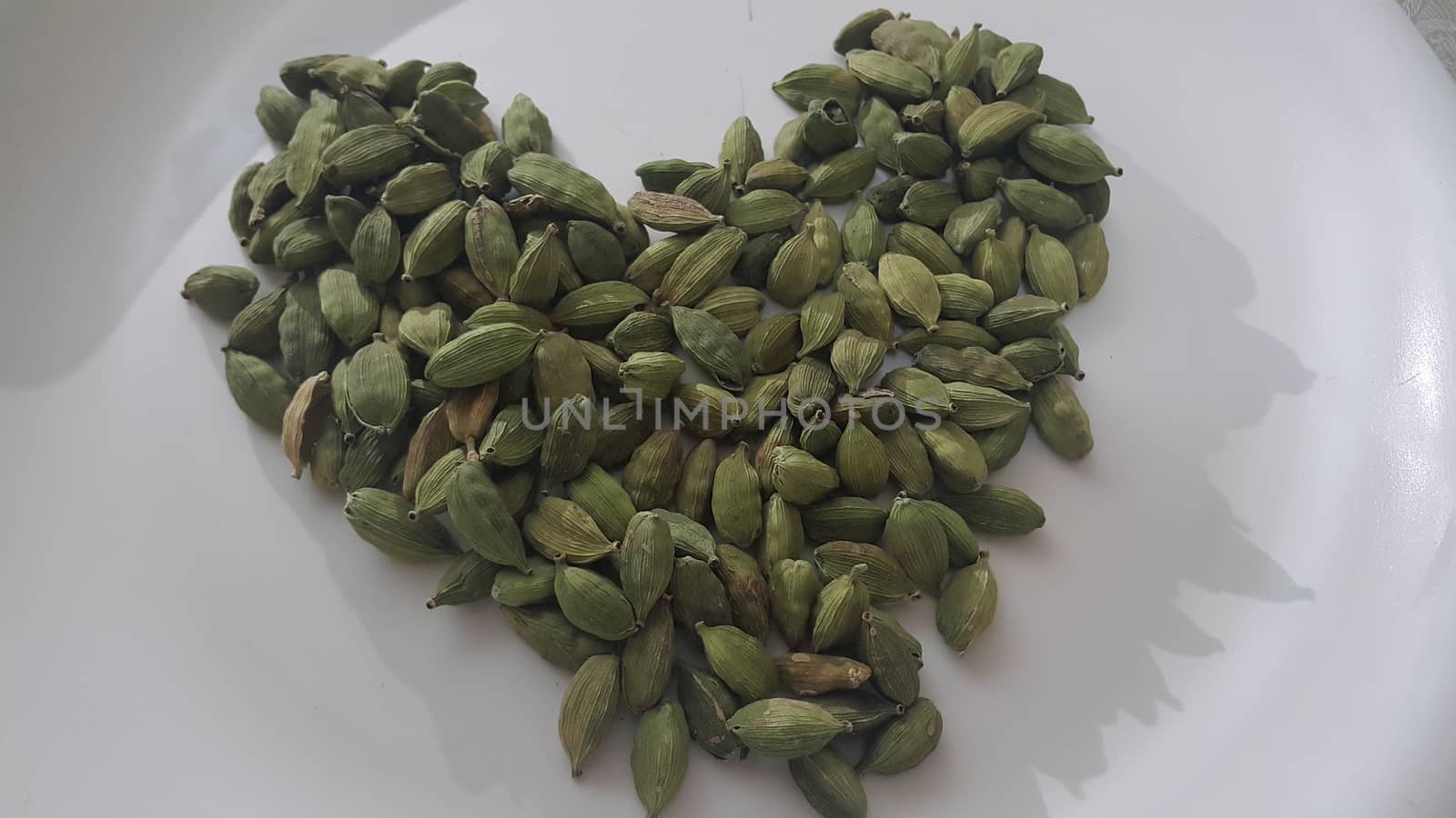 Elettaria cardamomum fruits with seeds, cardamom spice by Photochowk