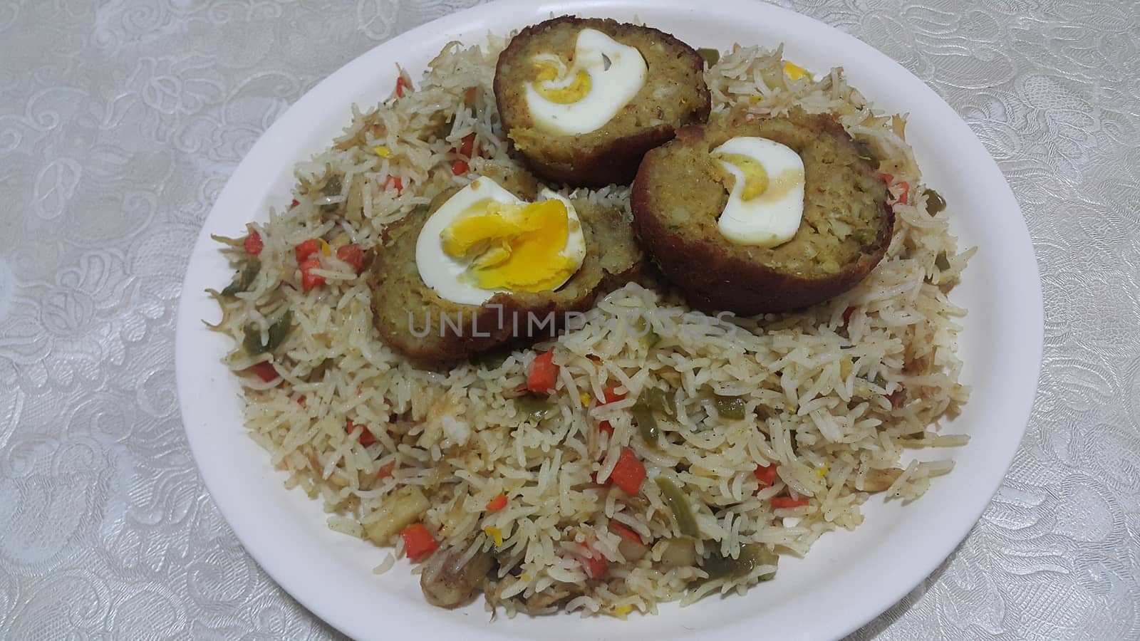 Top view of meat balls or meat kofta curry in Basmati rice pulao or pulav or vegetable rice dish