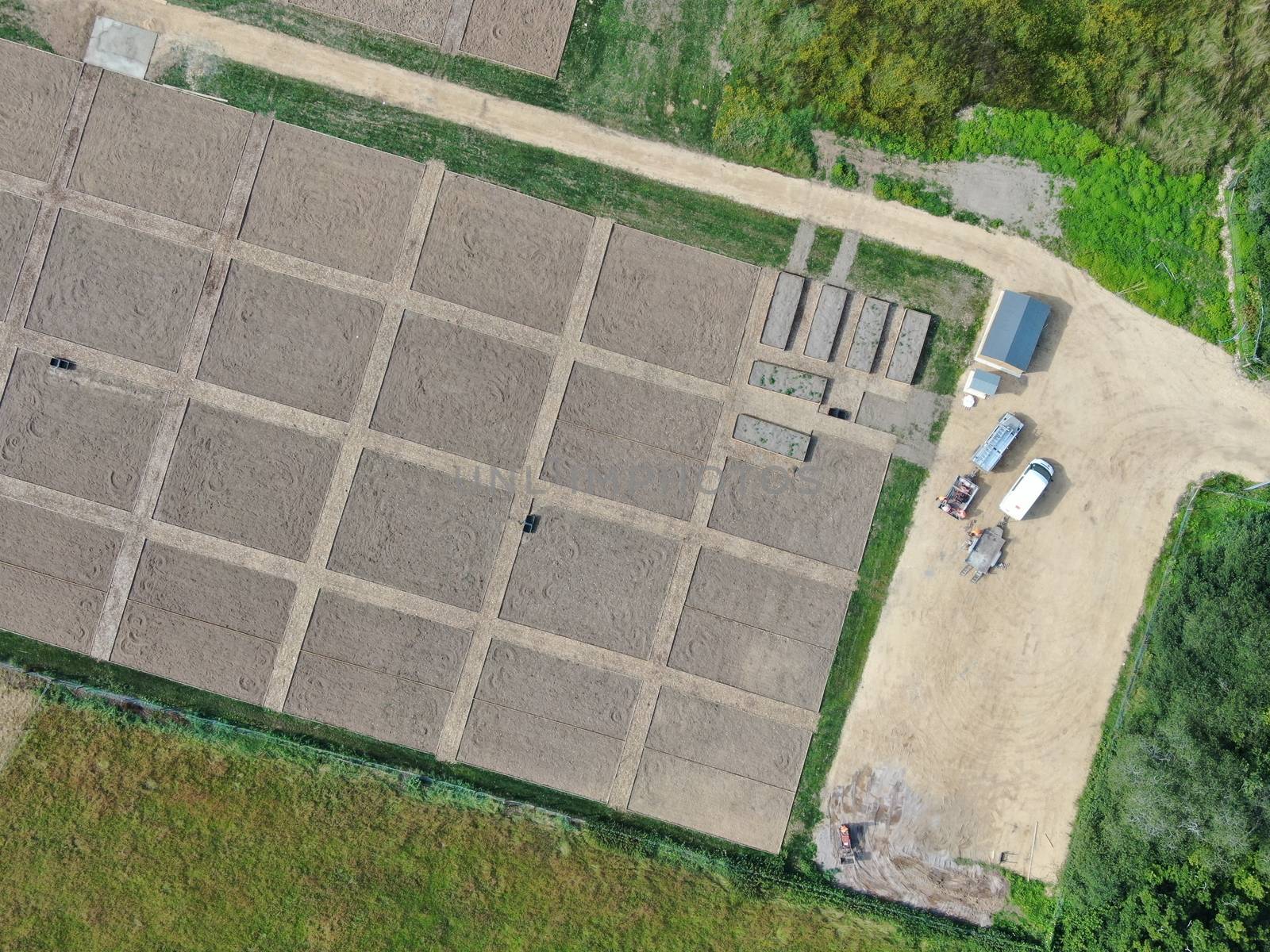 a view of recently laid out allotments pre-planting form directly overhead showing borders and bare earth