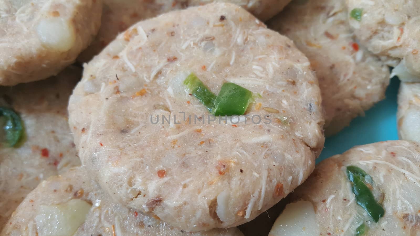 Spicy and tasty uncooked kebab stuffed with minced meat, onion,  alo paste and chana. Asian spicy cuisine.