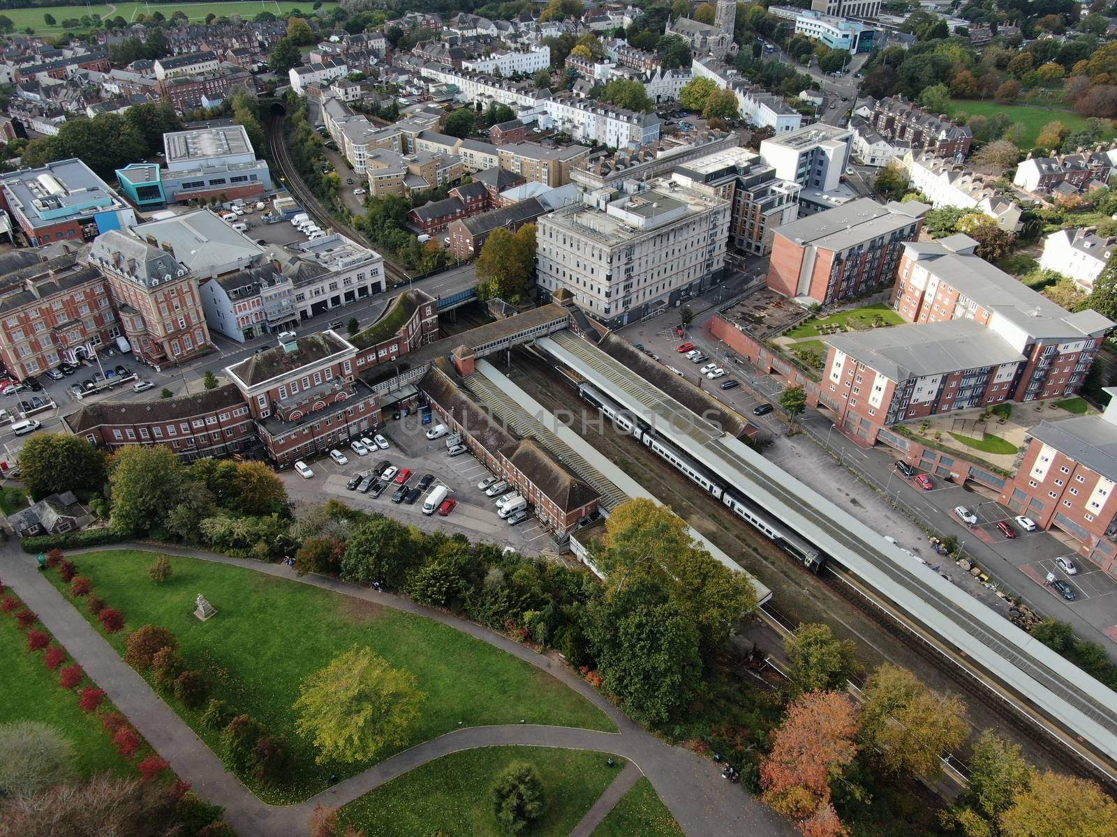 a drone shot of Exeter City centre in Devon , UK, showing Exeter Central station and the Rougemont Hotel.