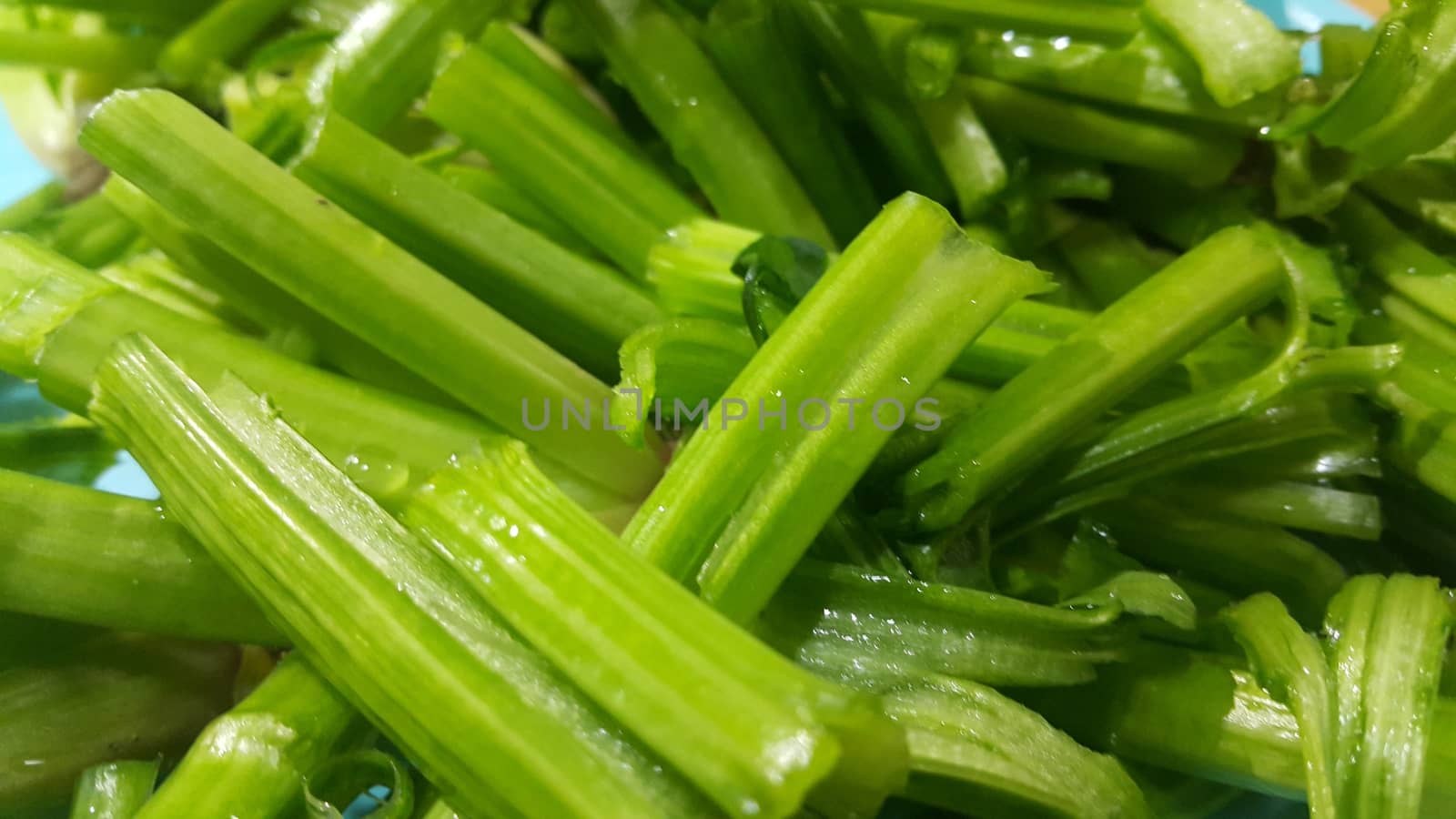 Close up view of lush green leaves base of spinach or paalak saag used for making