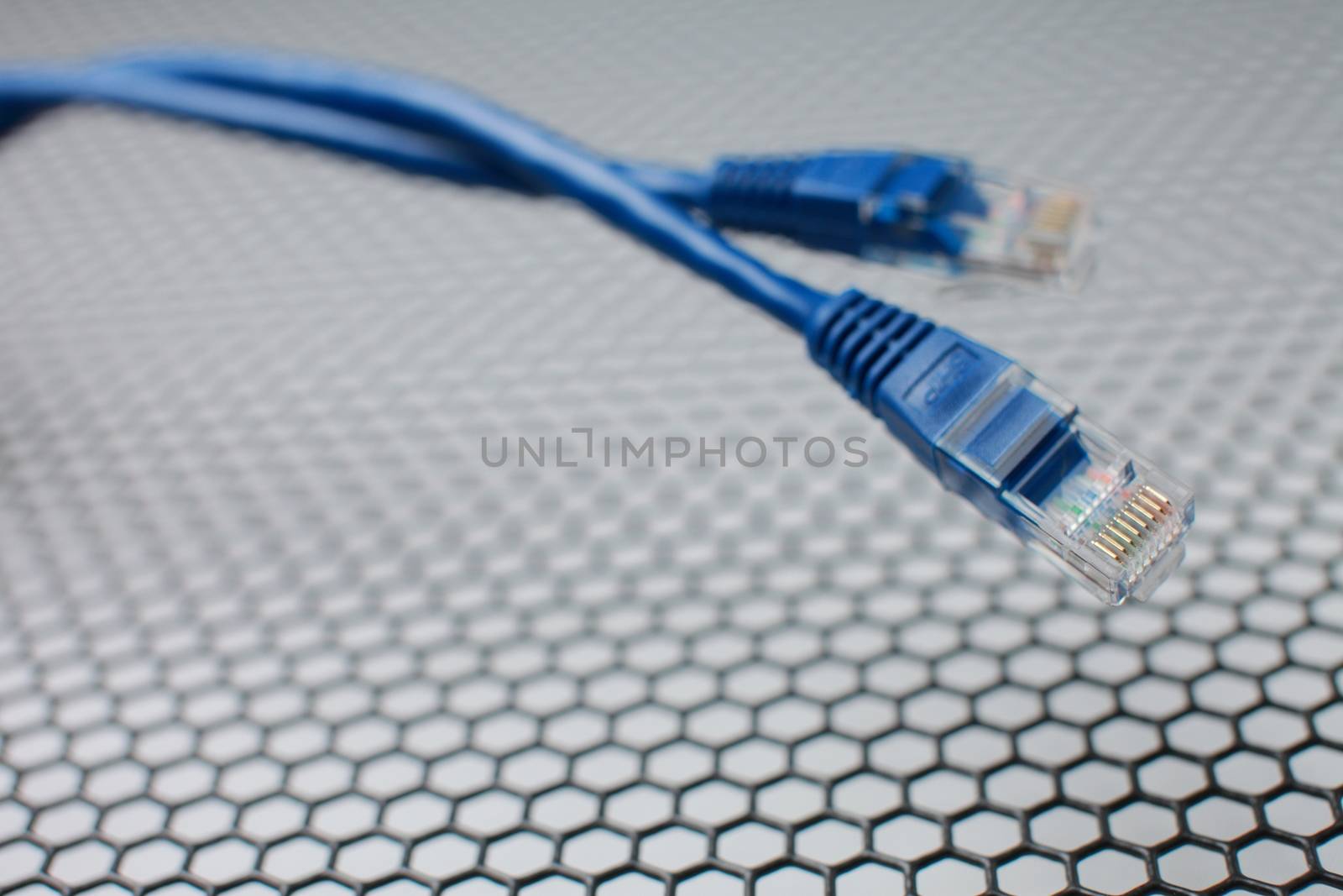 Network Ethernet Cables. Network switch with optical and ethernet connected wires. by selinsmo