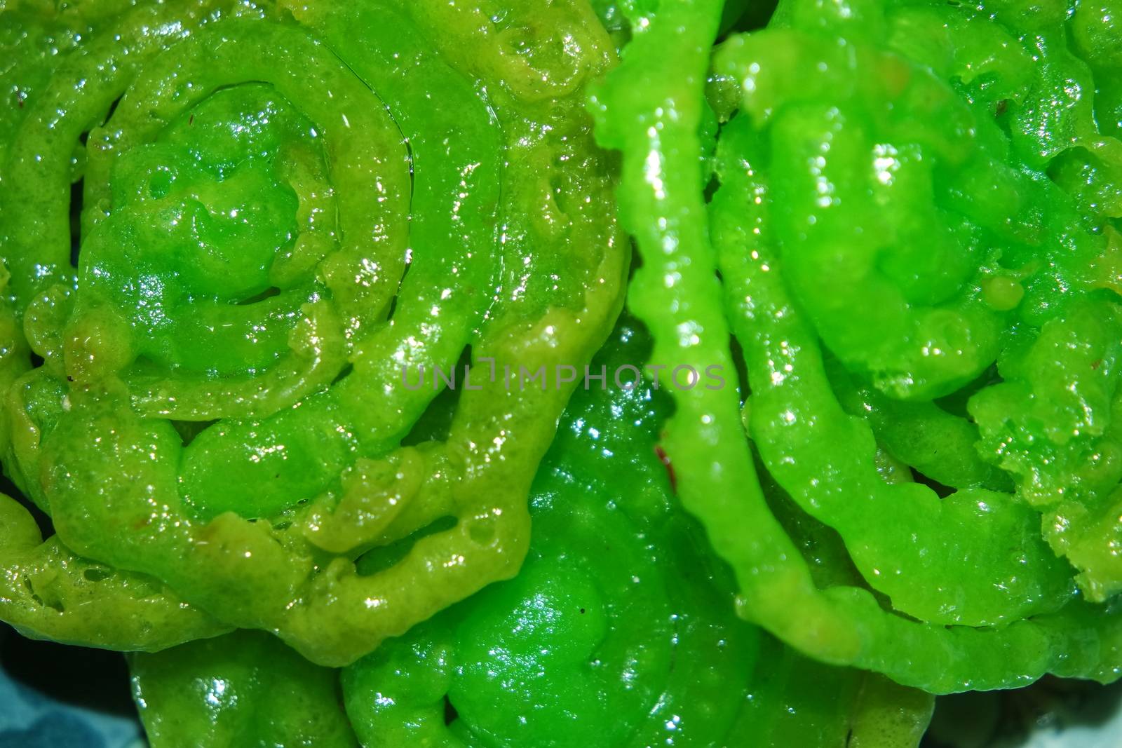 Crispy sweet Asian dessert green Jalebi cooked and served in Festivals. by Photochowk