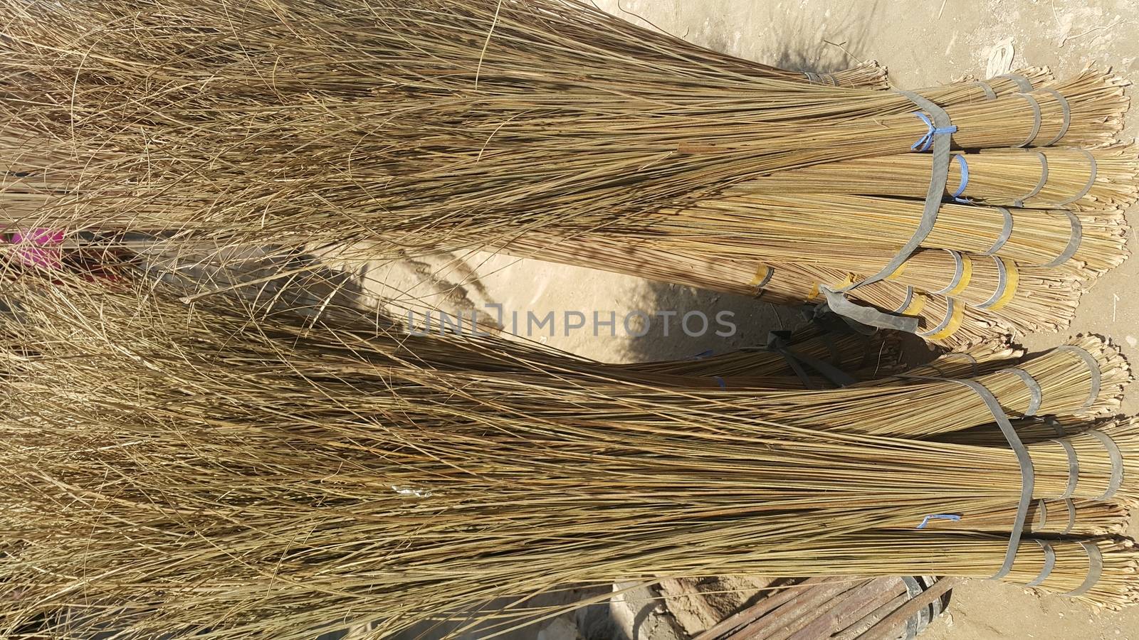 Old style broom used for housekeeping in rural area in Asian countries. by Photochowk