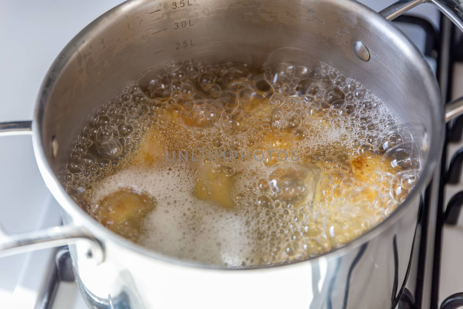 Pan of potatoes cooking in boiling water