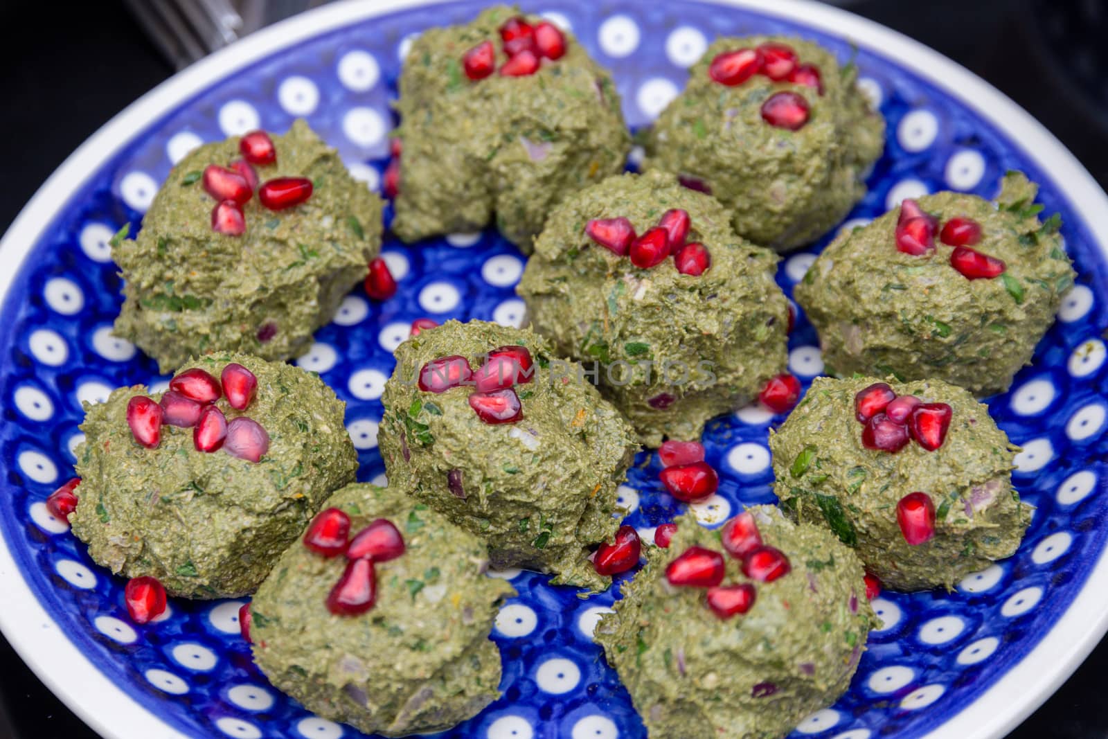 Pkhali, a Georgian vegetable dish with spinach, walnuts and pomegranate seeds