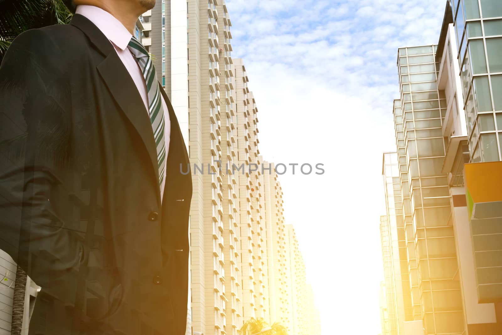 businessman leadership wearing in a city with buildings looking at city skyline at sunset the concept of modern life business