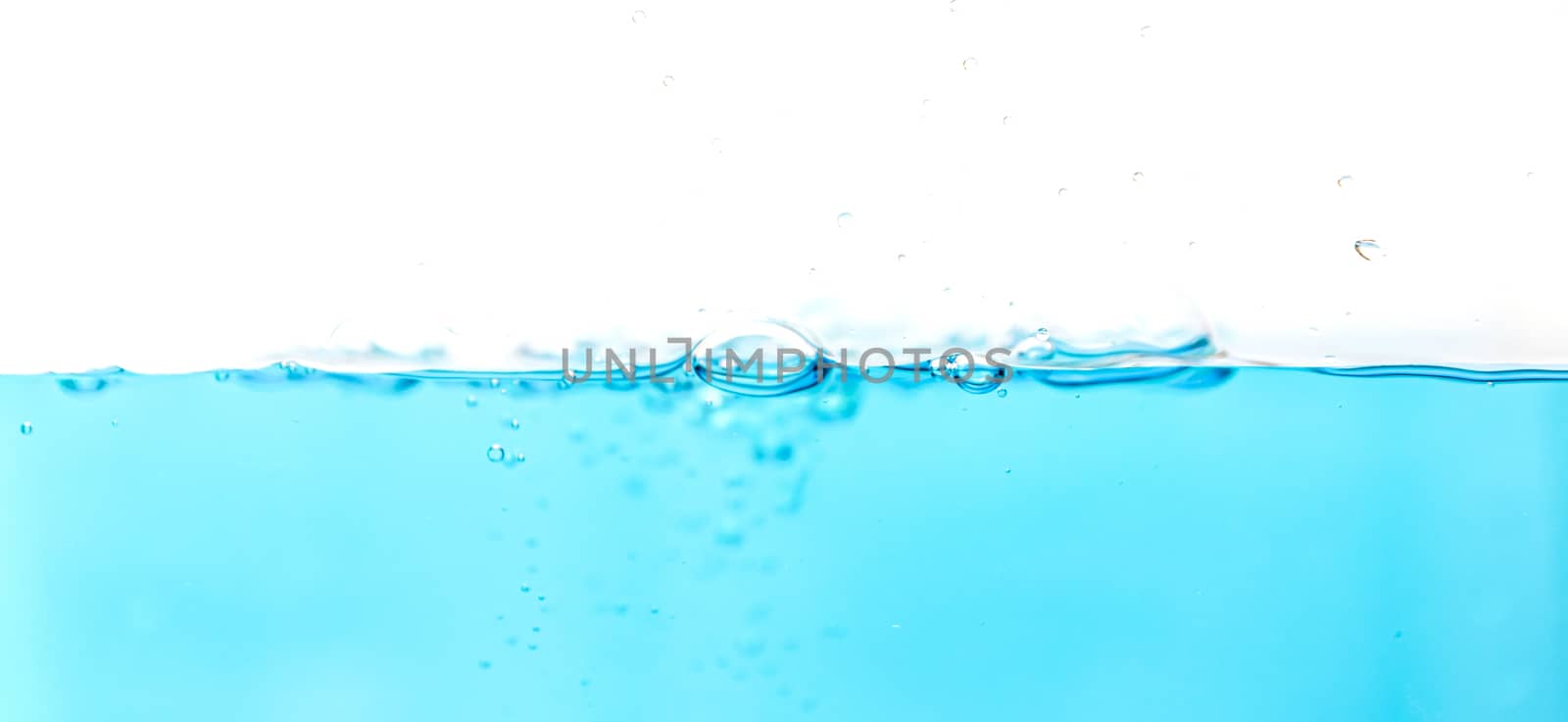 Water splash with bubbles of air blue water wave fefreshing abstract background by sompongtom
