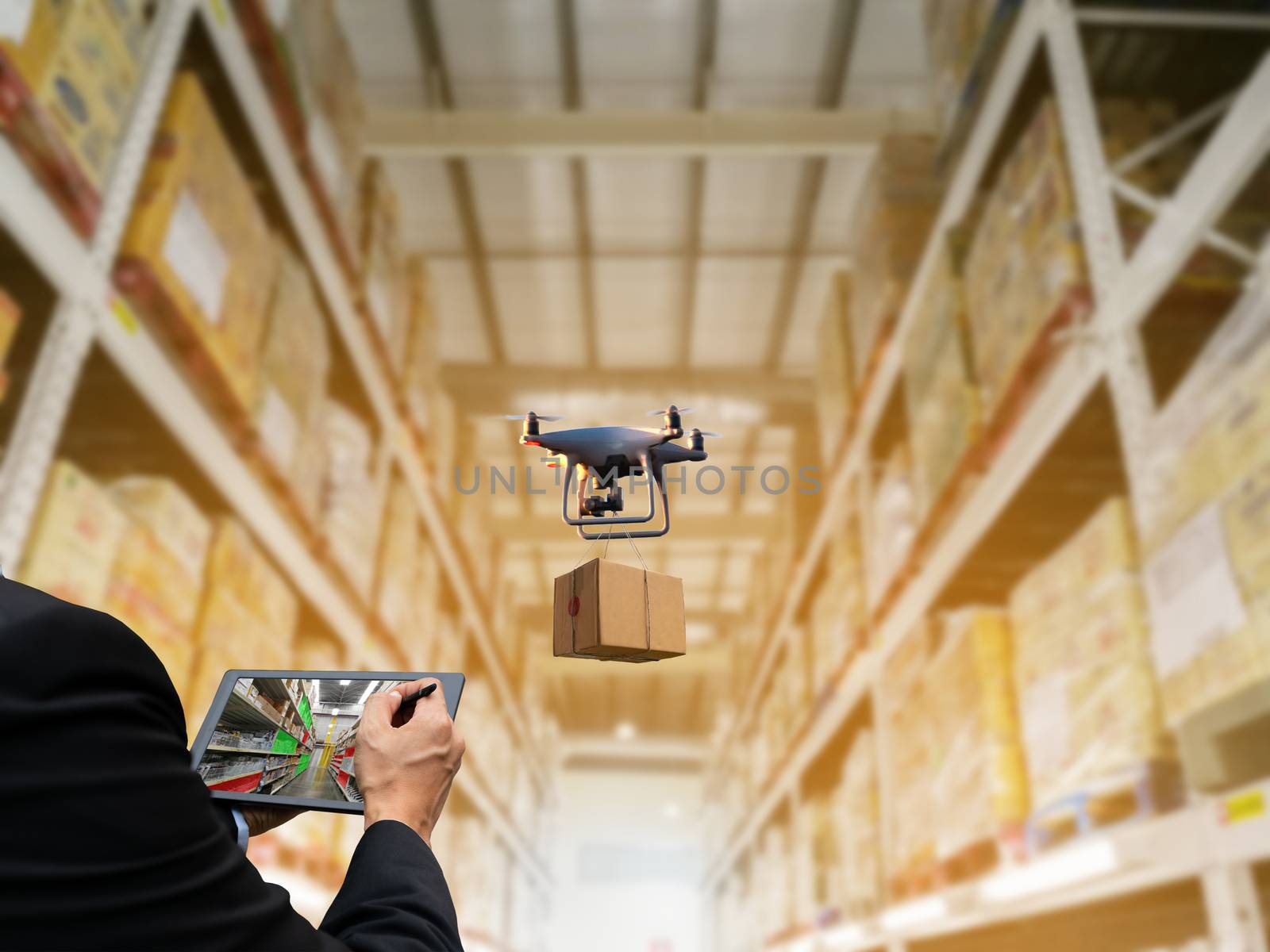 Person holding tablet control Industrial stock storage products storage system by drone unmanned aircraft by sompongtom