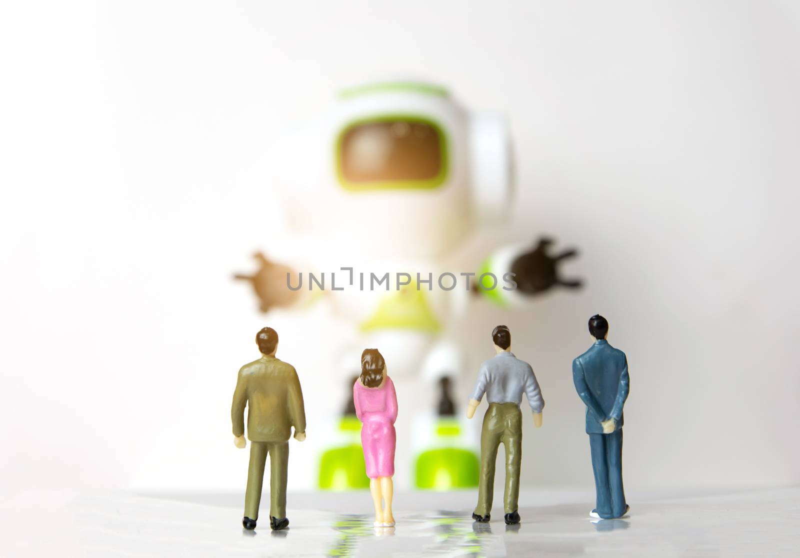 The little person businessman small stand to see robot technology by sompongtom