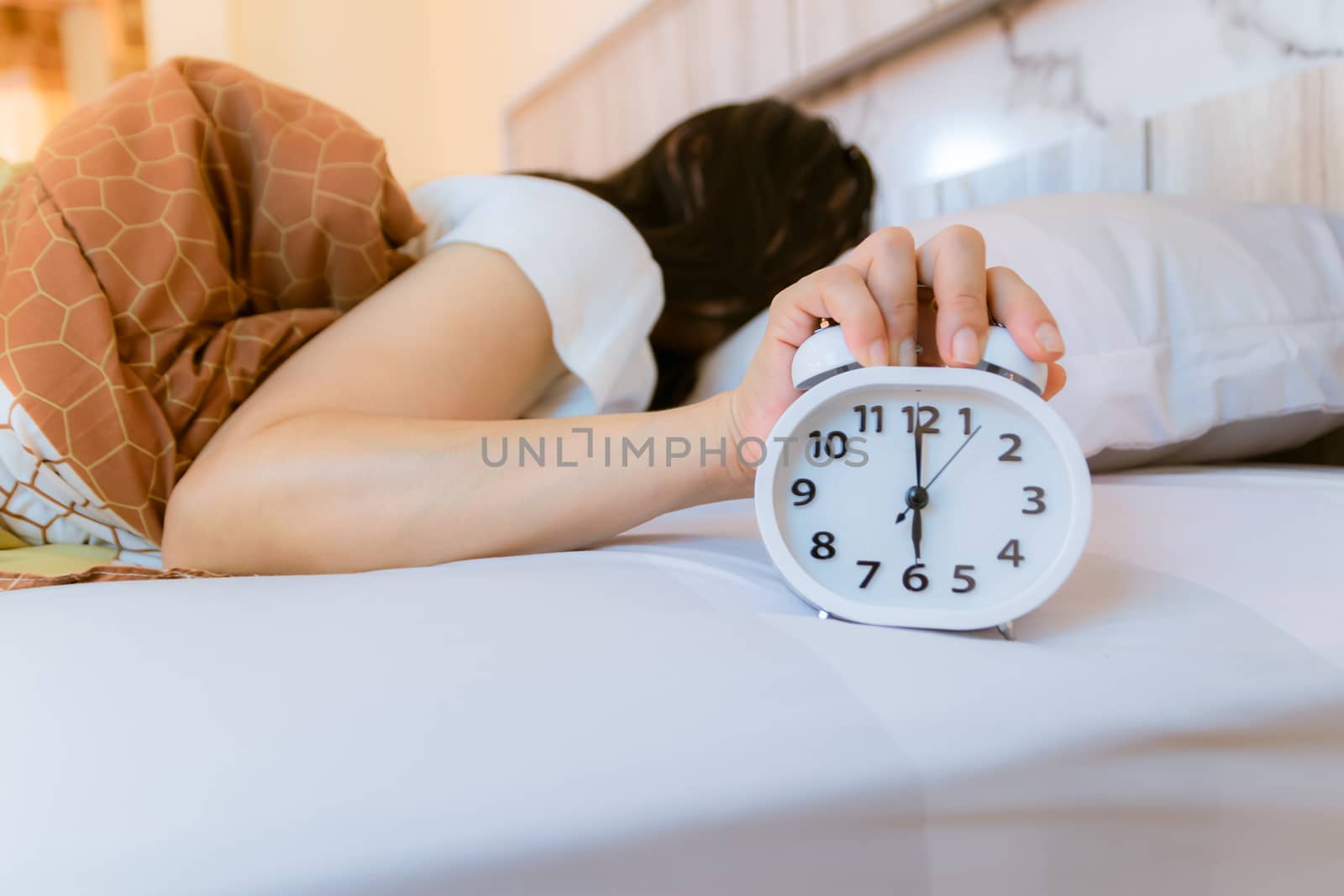Alarm clock that wakes up in the morning in the bedroom
