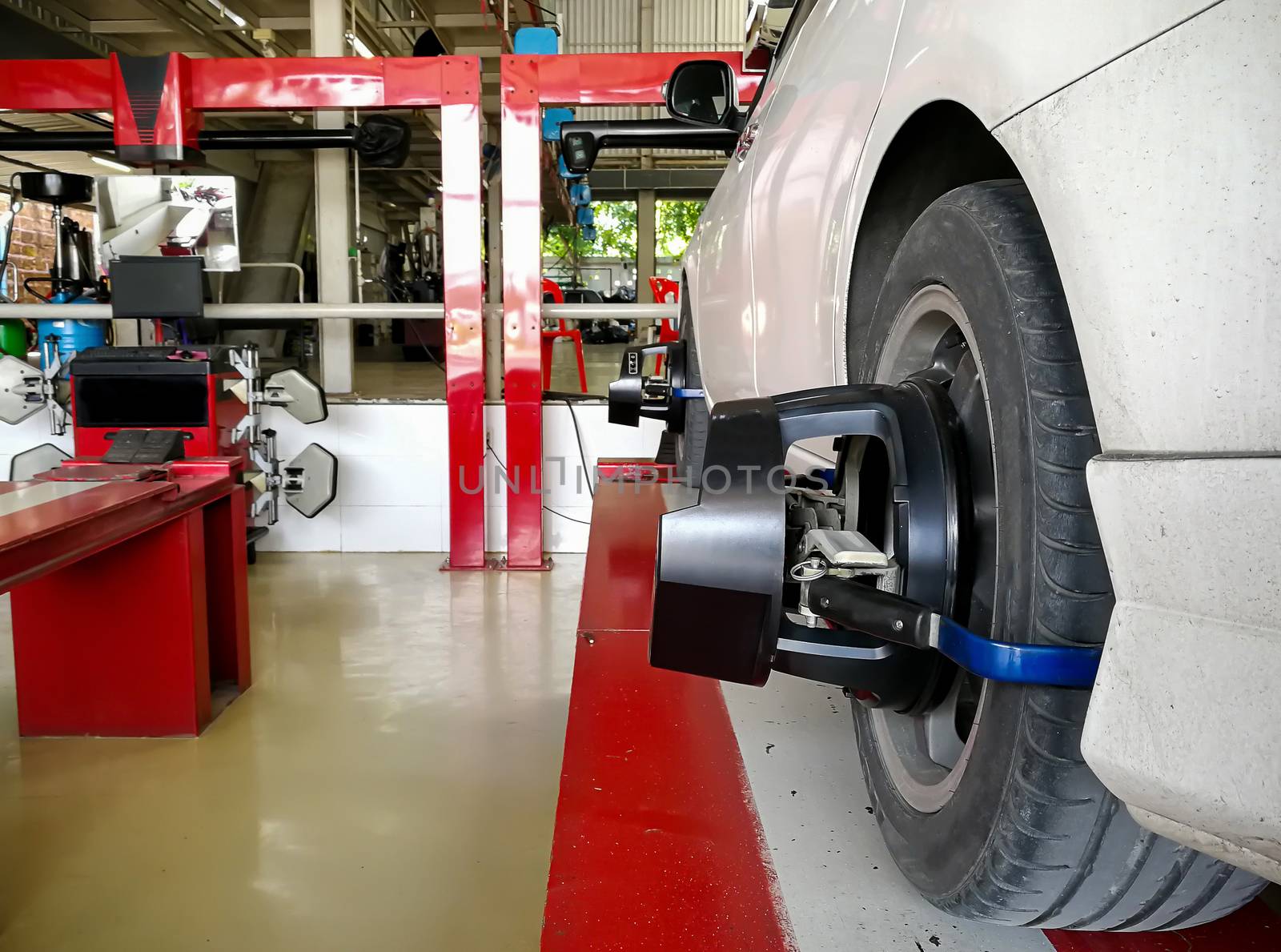 The car checks the wheel sensors on for wheels alignment by sompongtom