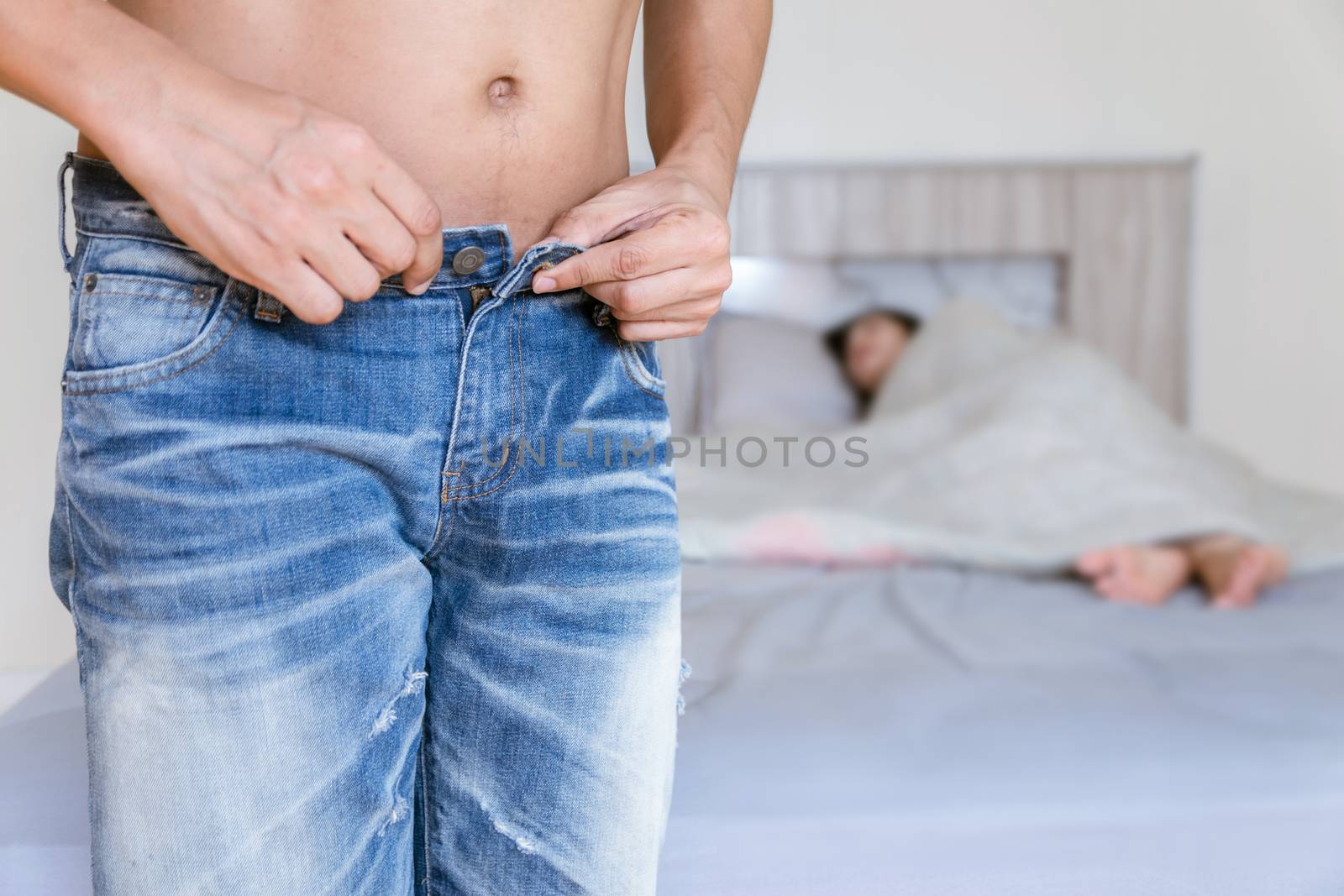 Men are taking off their pants to have of couple in bedroom is having sex.