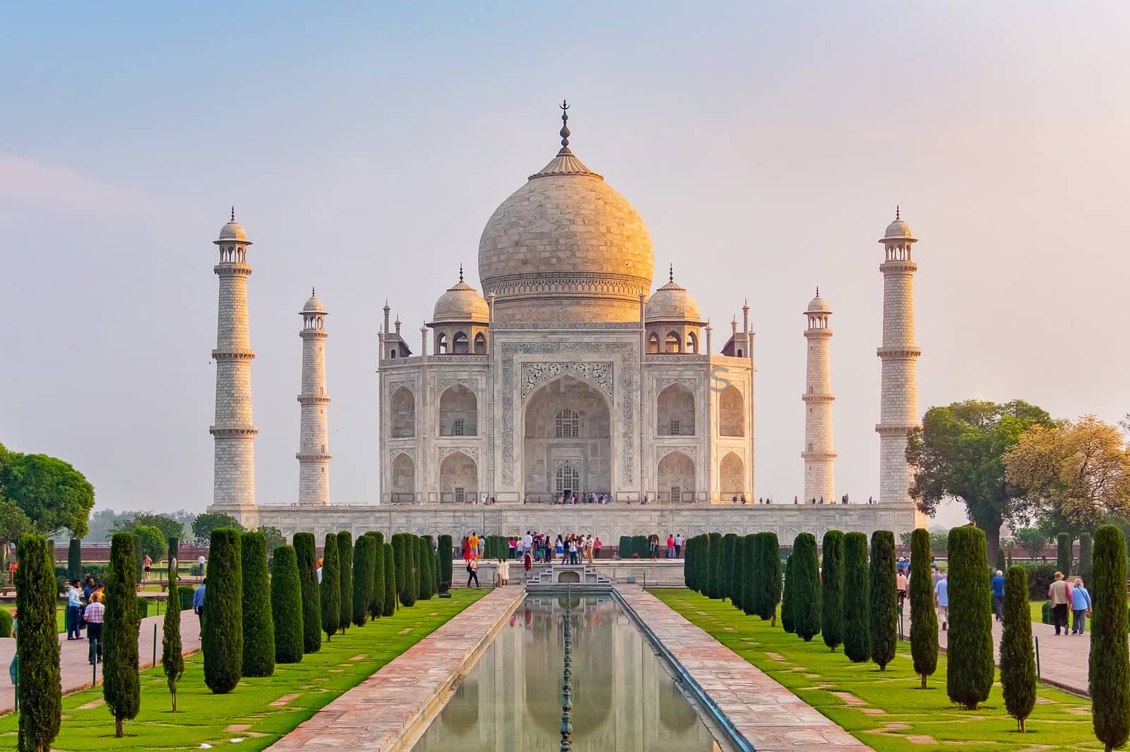 Taj Mahal front view reflected on the reflection pool, an ivory-white marble mausoleum on the south bank of the Yamuna river in Agra, Uttar Pradesh, India. One of the seven wonders of the world.