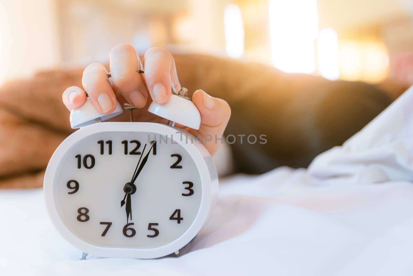 Alarm clock that wakes up in the morning in the bedroom