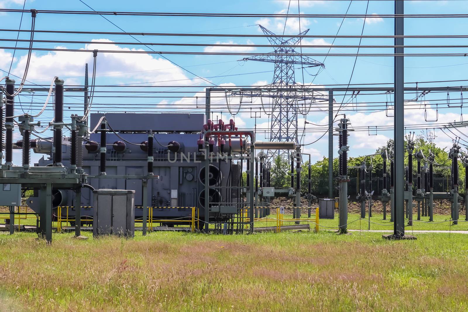 Electrical Transformer. Distribution of electric energy at a big substation with lots power lines