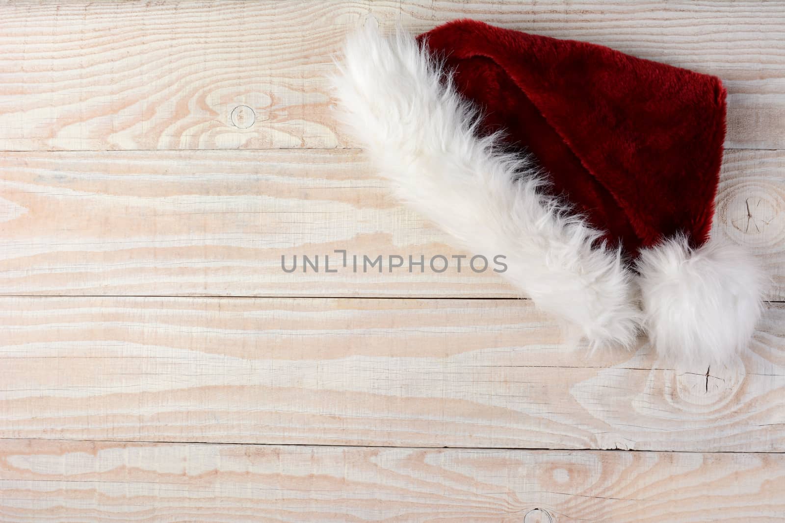Santa Hat on Wood Surface by sCukrov