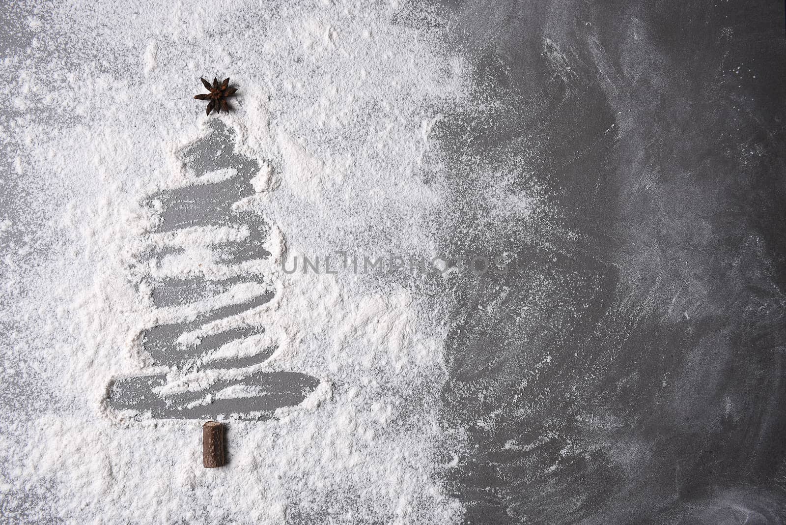 Flour on a baking sheet in a Christmas tree shape  by sCukrov