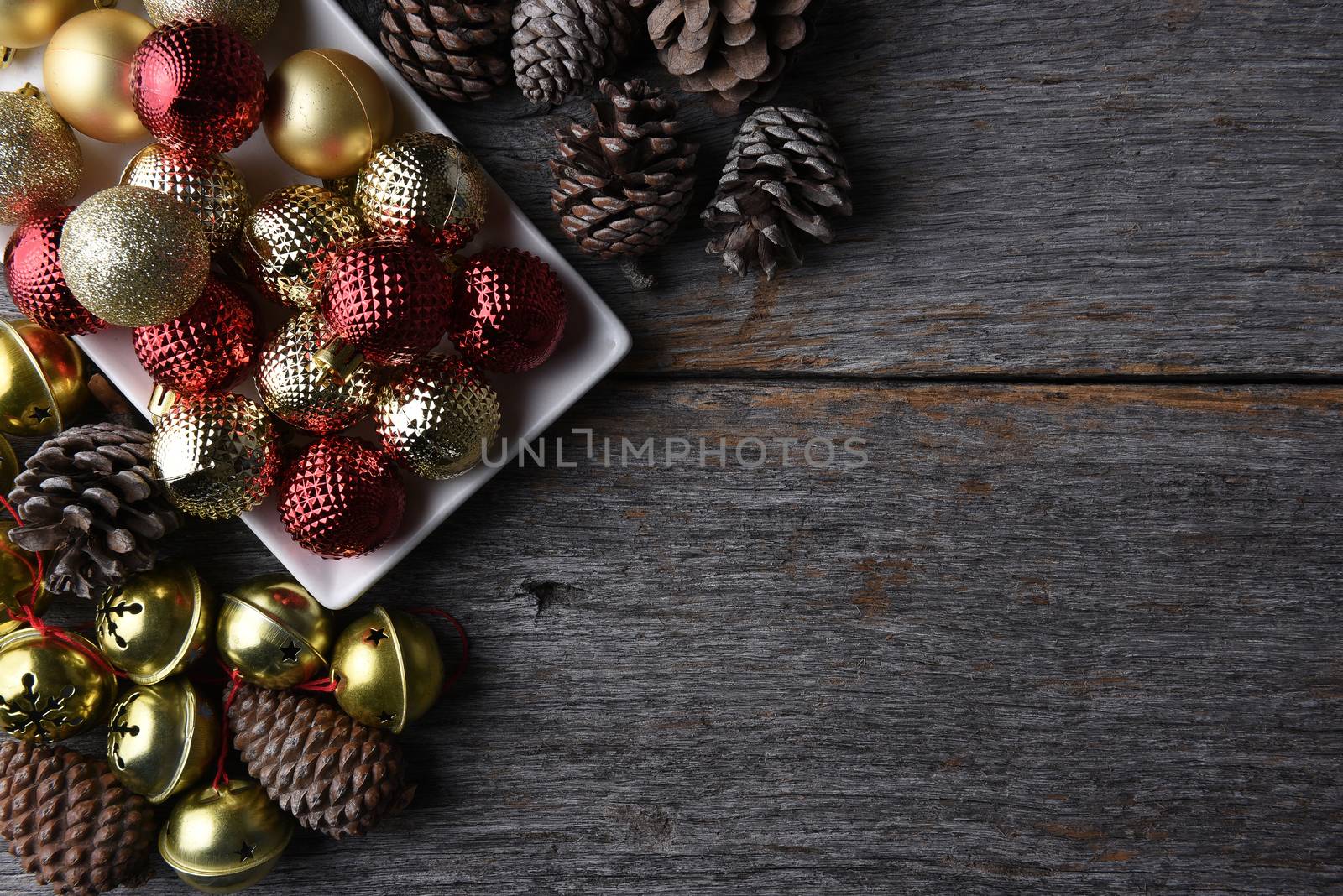 Christmas ornaments and decorations on a rustic wood table with copy space.