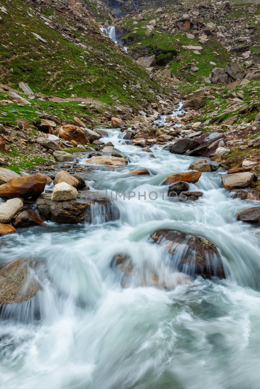 Waterfall in Himalayas mountains in Koksar, Lahaul Valley, Himachal Pradesh, India