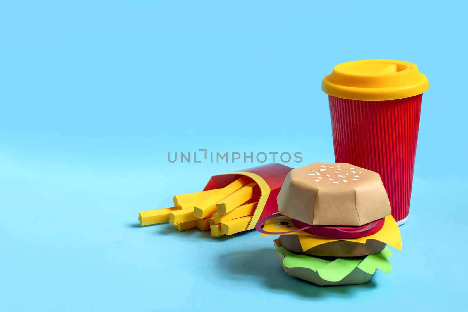 Handmade paper hamburger, french fries in box and drink in paper cup. Paper art and craft. Real volumetric handmade paper objects