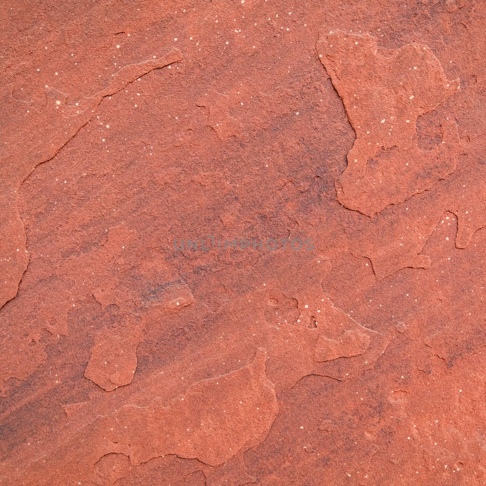 Red rough stone texture background. by Tanarch