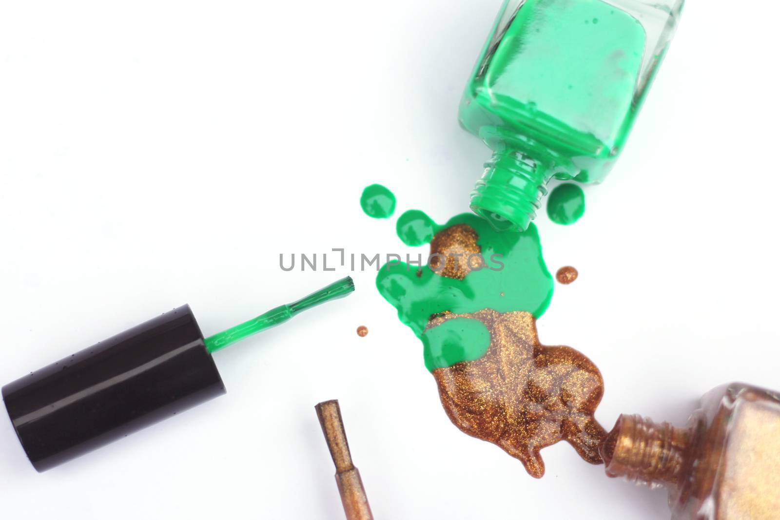 Green and Gold Nail polish  Spilled on White by Marti157900