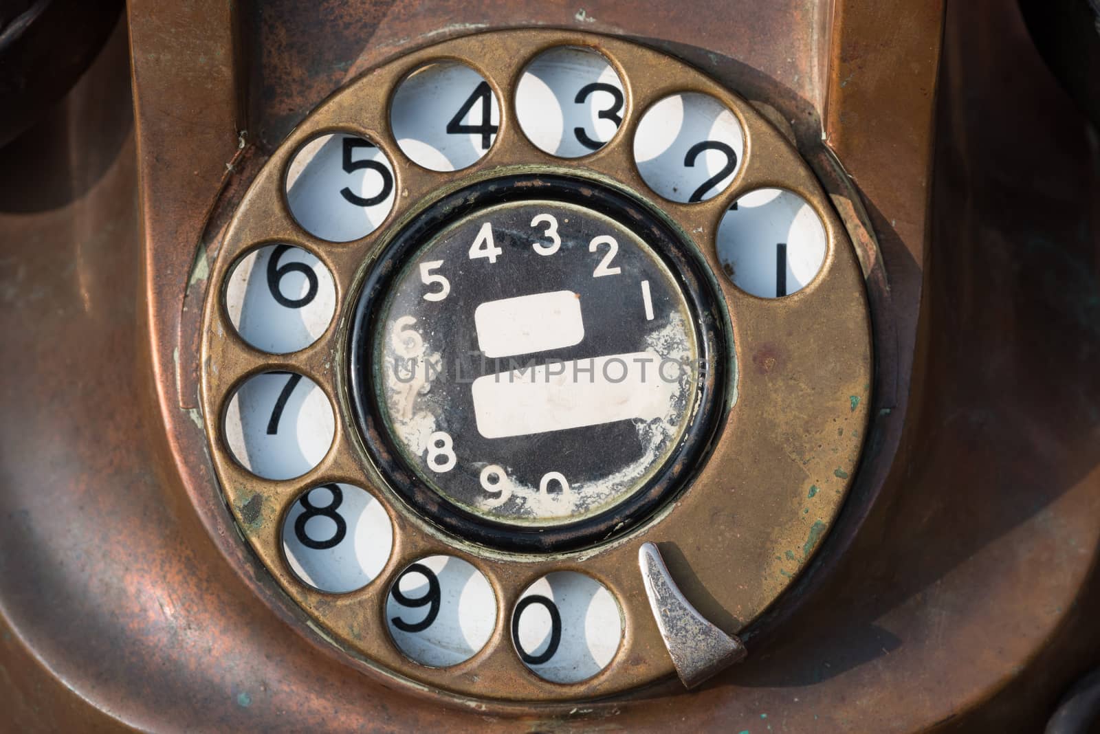 old brown antique rotary style telephone close-up