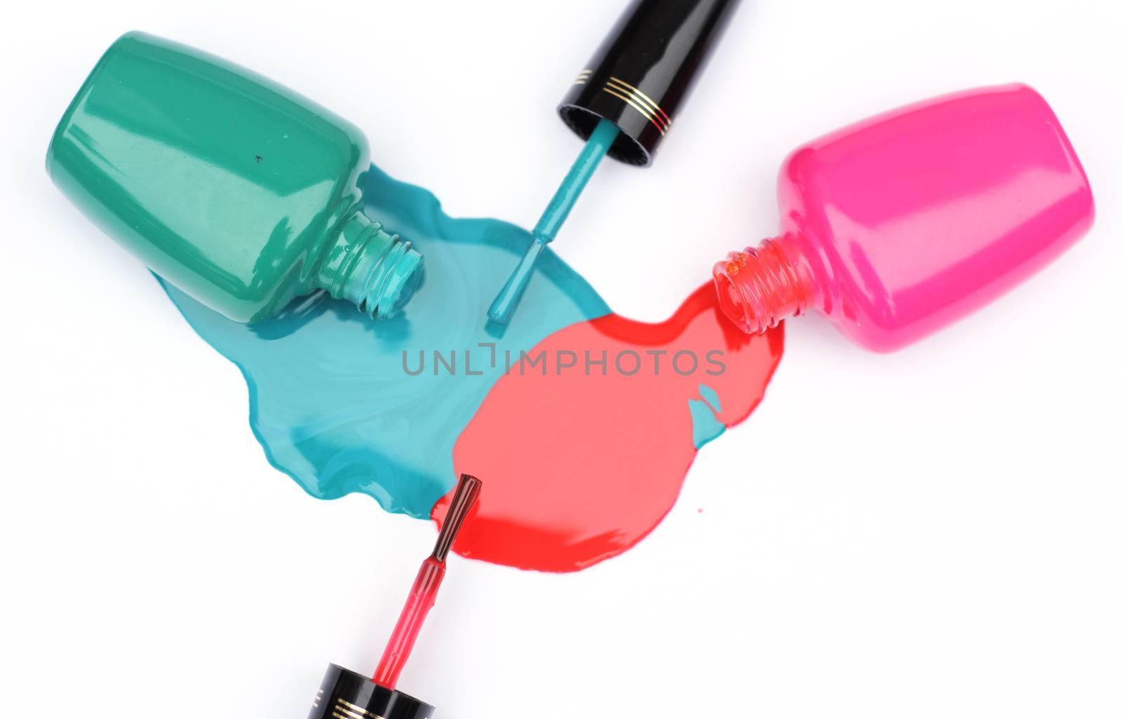 Spilled Nail Polish on White Background Pink and Green