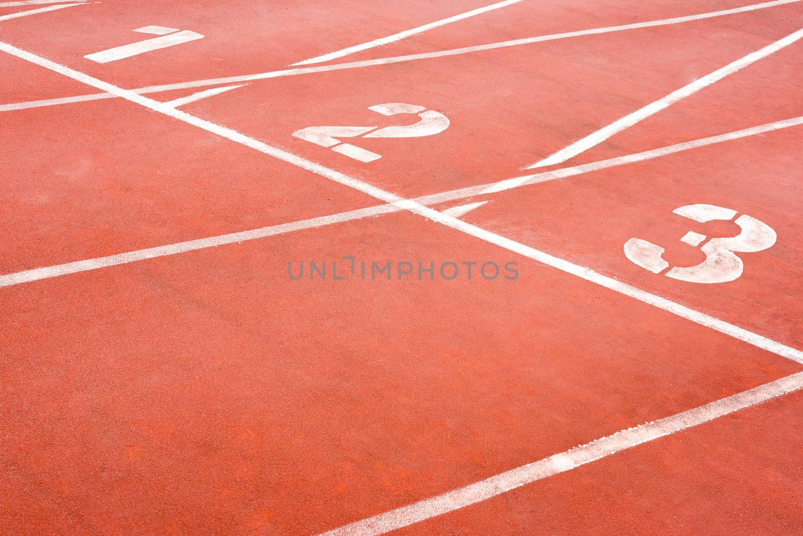 1 2 3 Orange athletic tracks close-up in a stadium