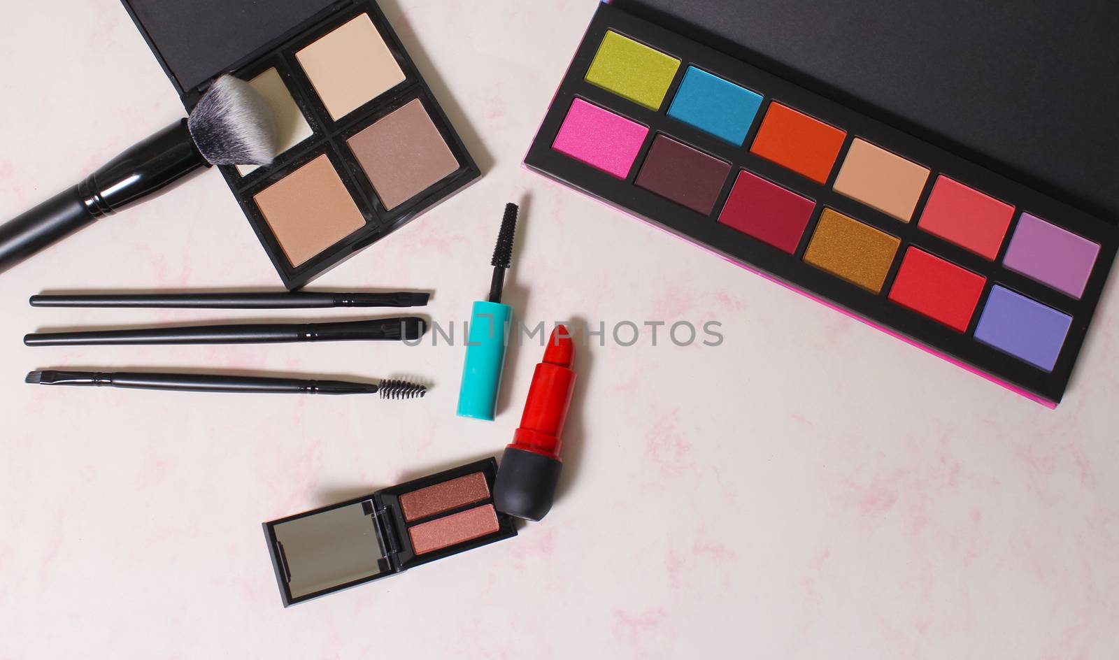 Colorful Cosmetics on paper background by Marti157900
