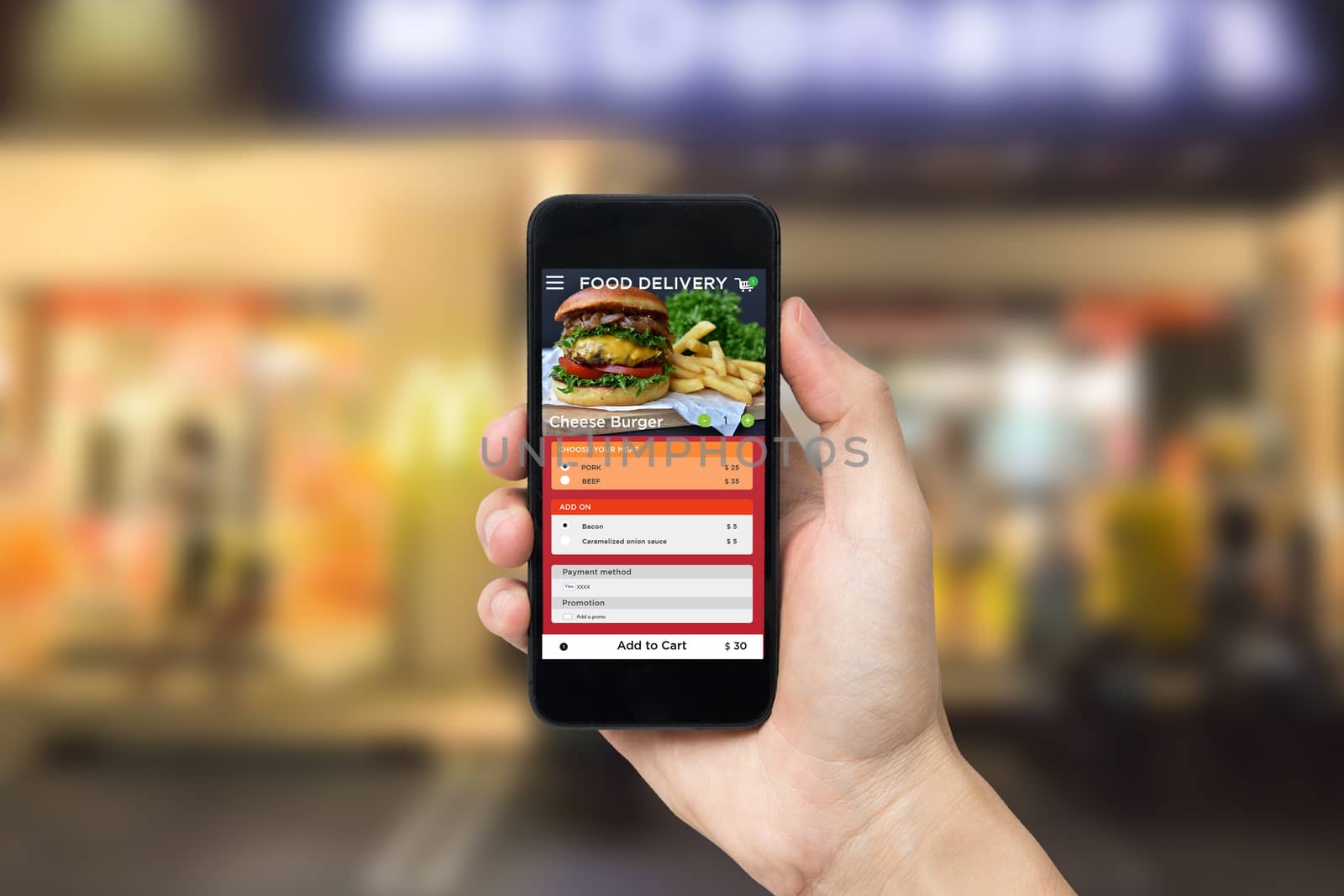 Hand holding smart phone with app food delivery order screen. application for restaurant service.