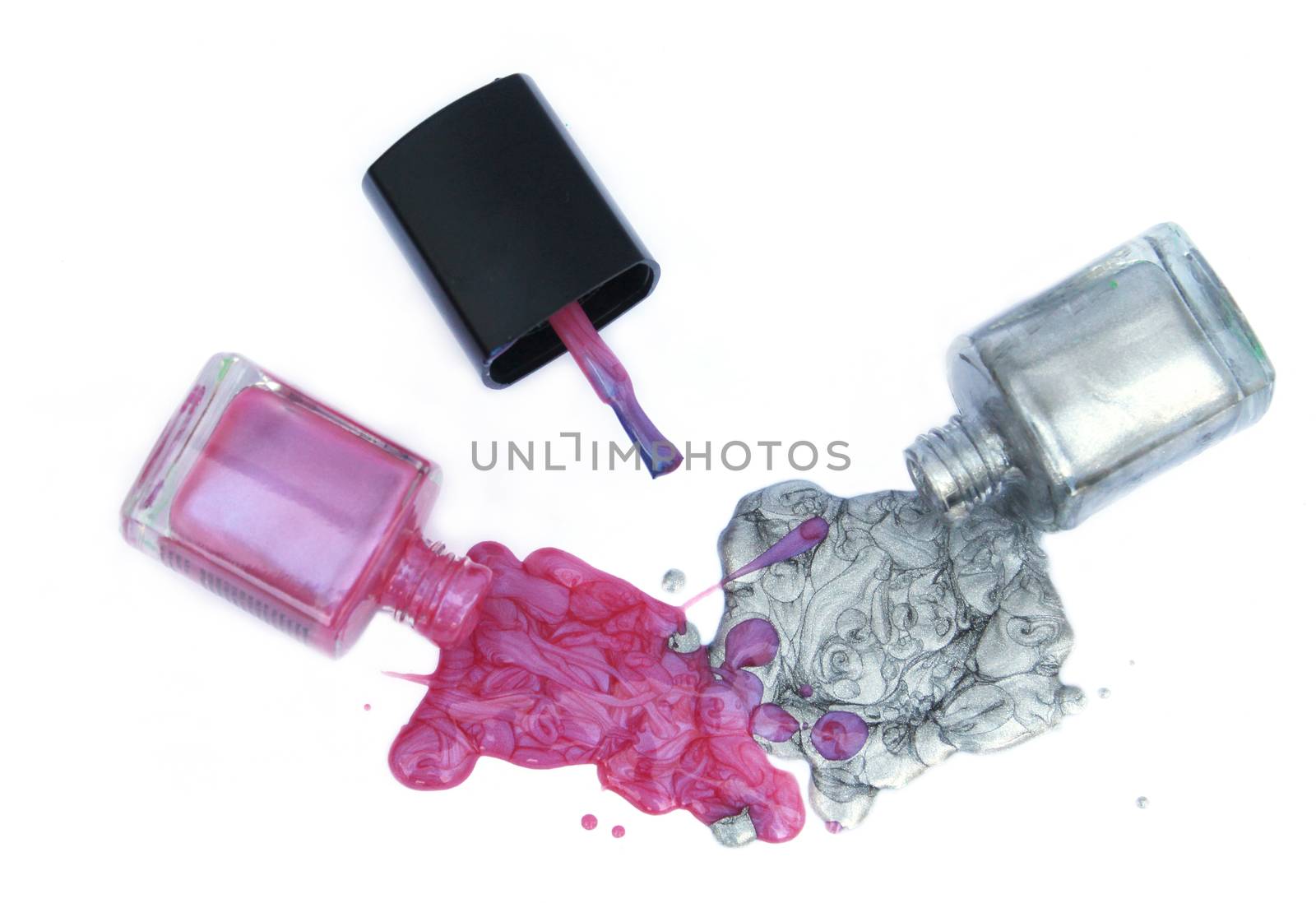 Pink and Silver Nail Polish on White Background