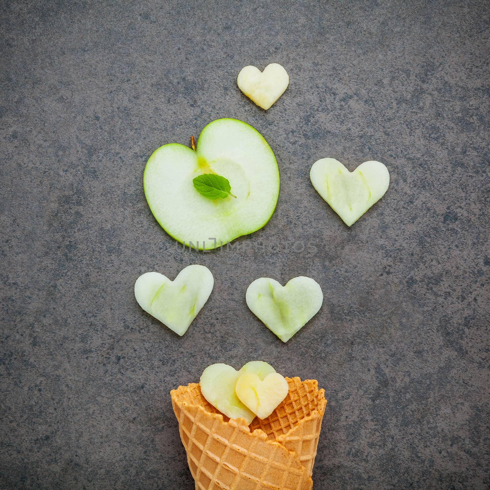 Apple slice in waffle cones and heart shape of apple setup on da by kerdkanno