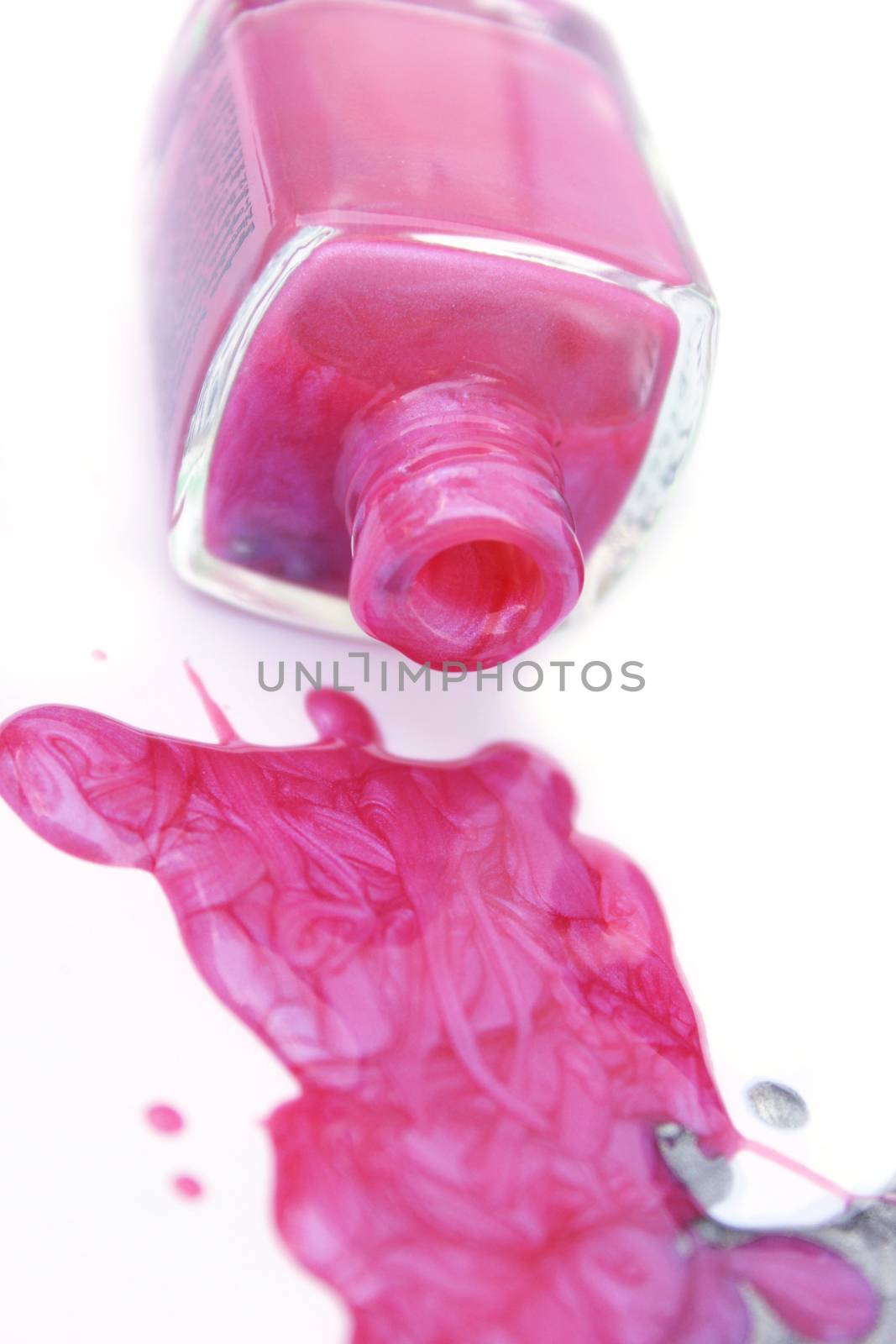 Pink and Silver Nail Polish on White Background