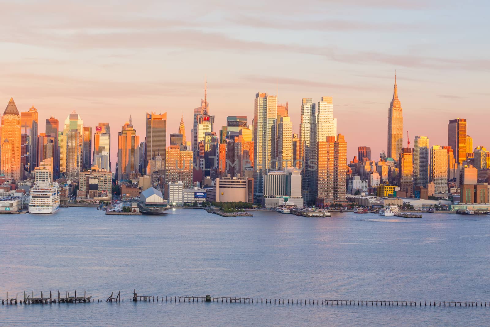 New York City midtown Manhattan sunset skyline panorama view over Hudson River in USA