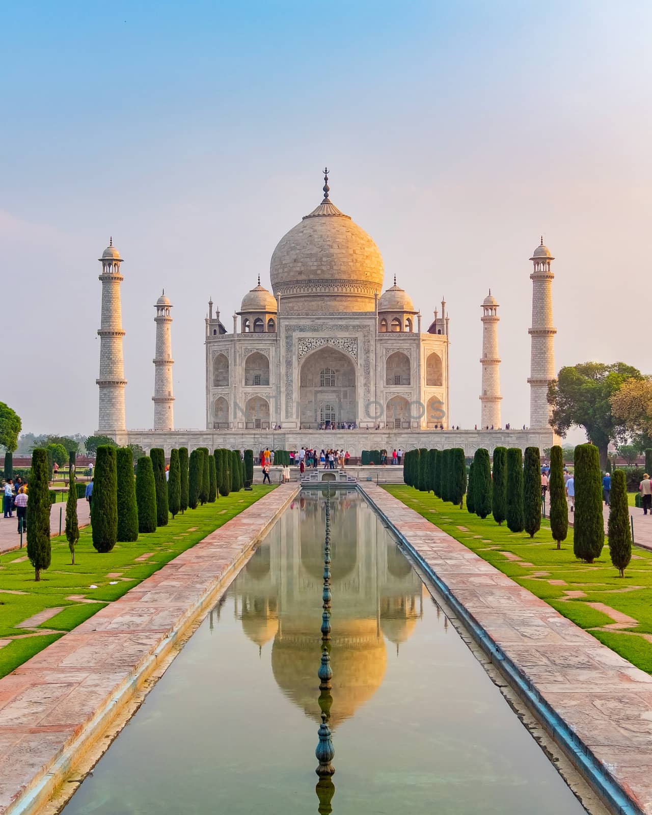 Taj Mahal front view reflected on the reflection pool, an ivory-white marble mausoleum on the south bank of the Yamuna river in Agra, Uttar Pradesh, India. One of the seven wonders of the world.