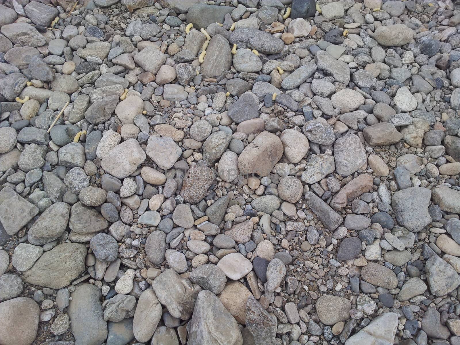 Transparent water surface with copy space for background and texture. Transparent water texture with view of stones under water.