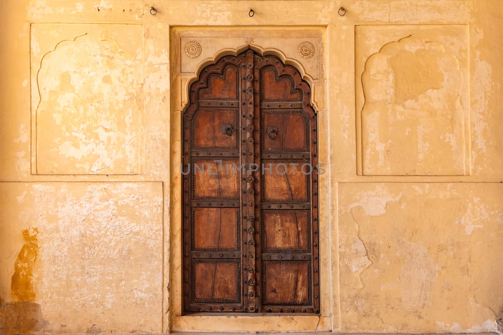 Antique rustic ancient wooden door. Architectural element.