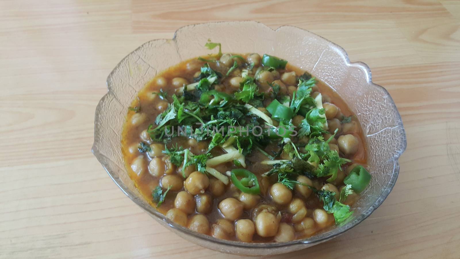 Traditional lentils Channa/Chola Masala or chick peas curry or chole bhature by Photochowk