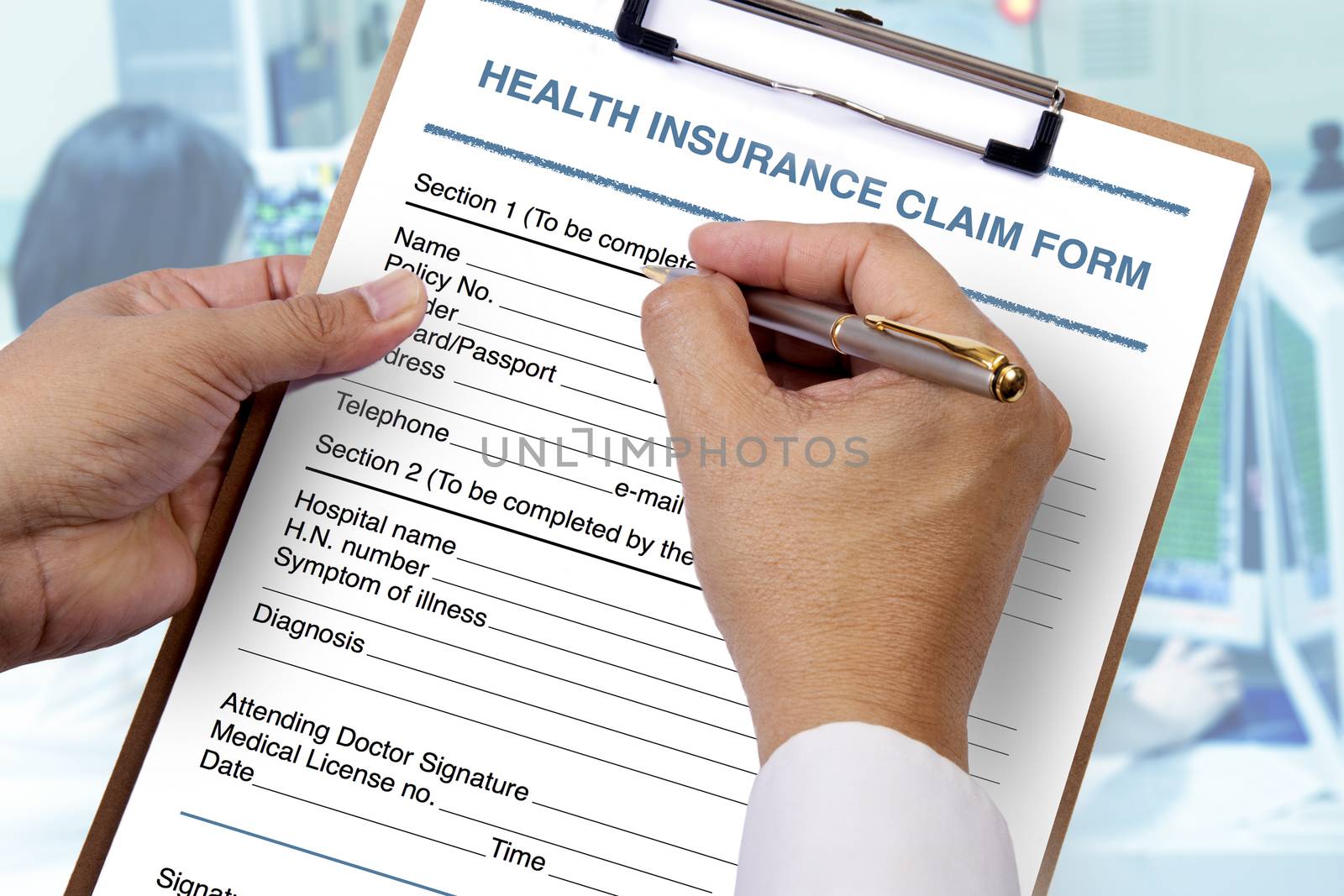 To complete blank health insurance form. by pandpstock_002