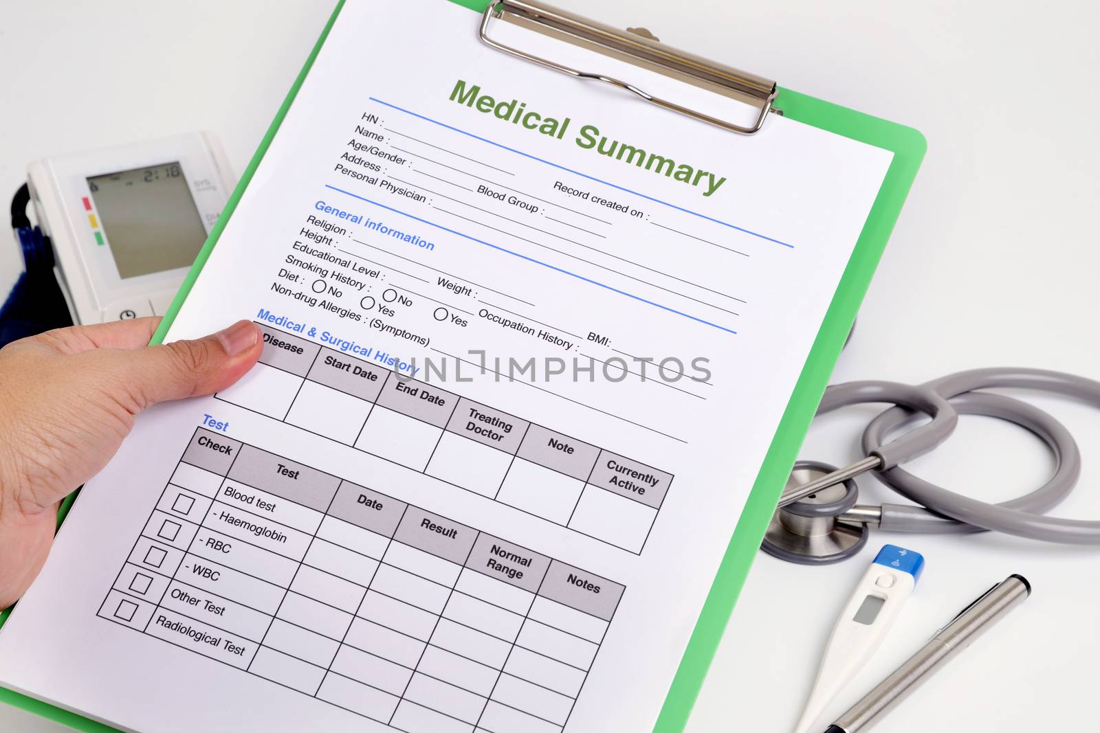 Personal health record form on clipboard in doctor's hand.