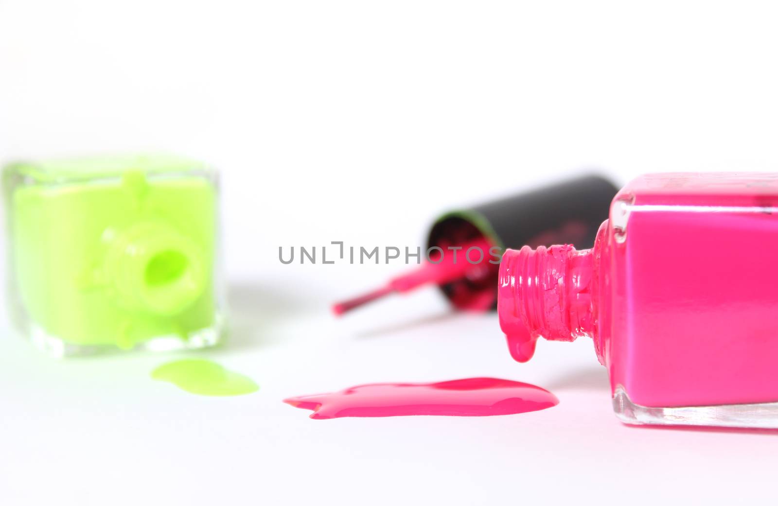 Pink and Yellow Neon Nail Polish on White by Marti157900