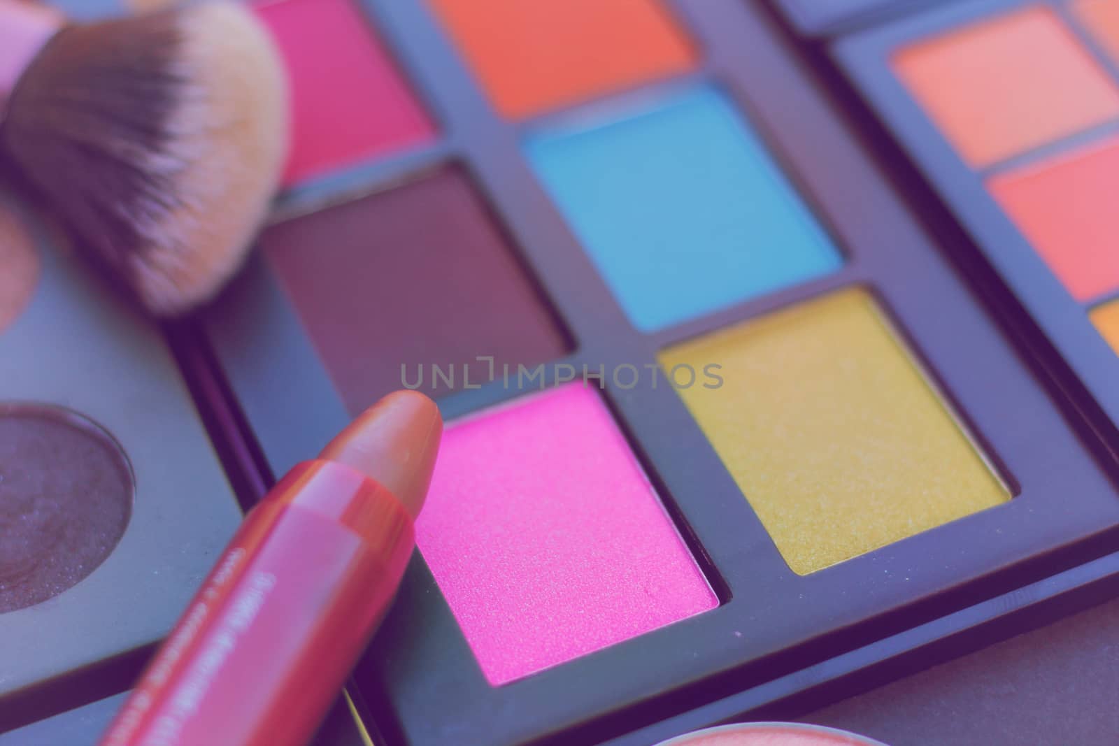 Colorful Cosmetic Pigment Palettes and Various Cosmetics and Brushes